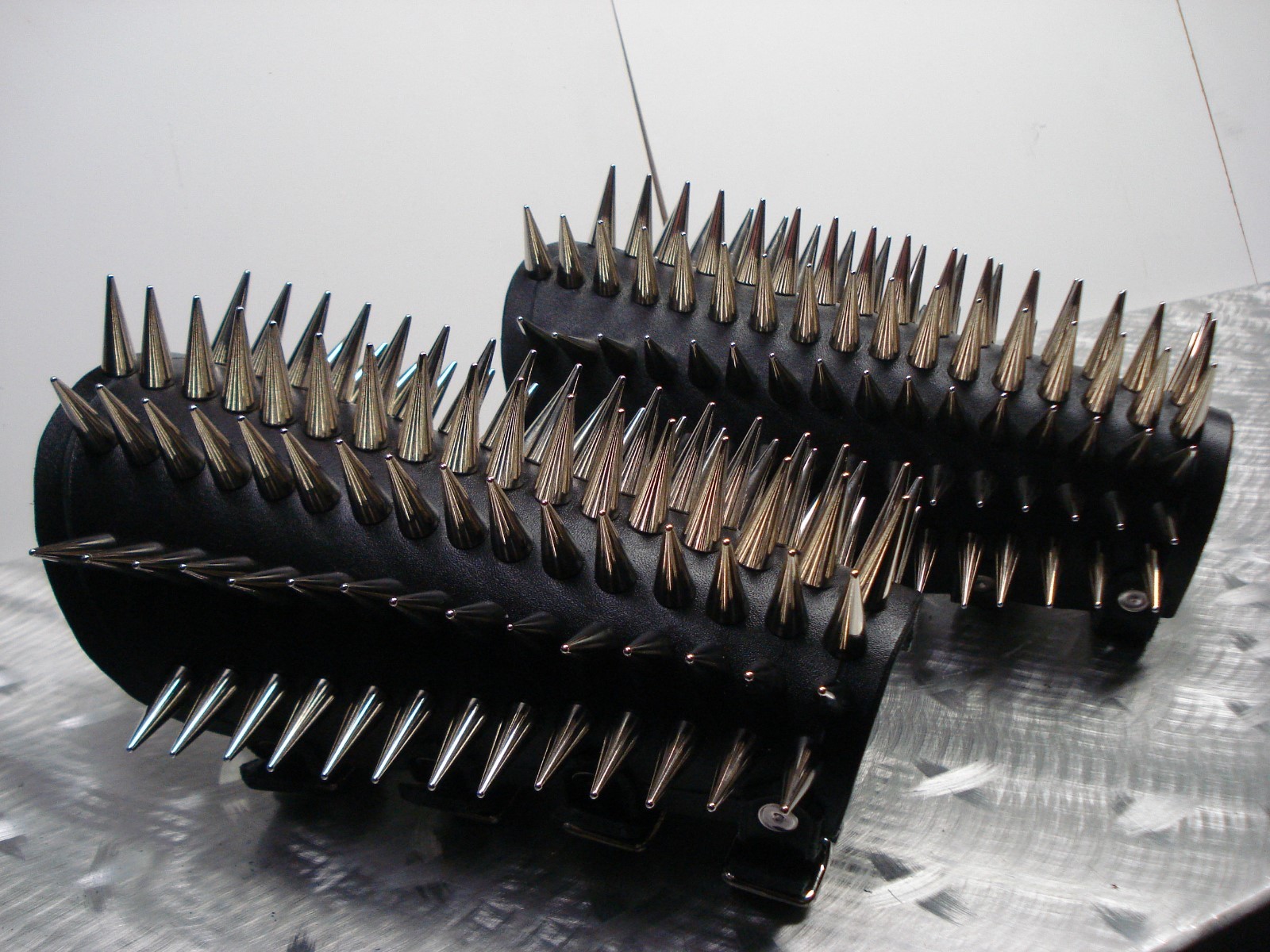 LEATHER SPIKED CONE GAUNTLET. BLACK METAL… (MDLG0231)….. BEHEXEN