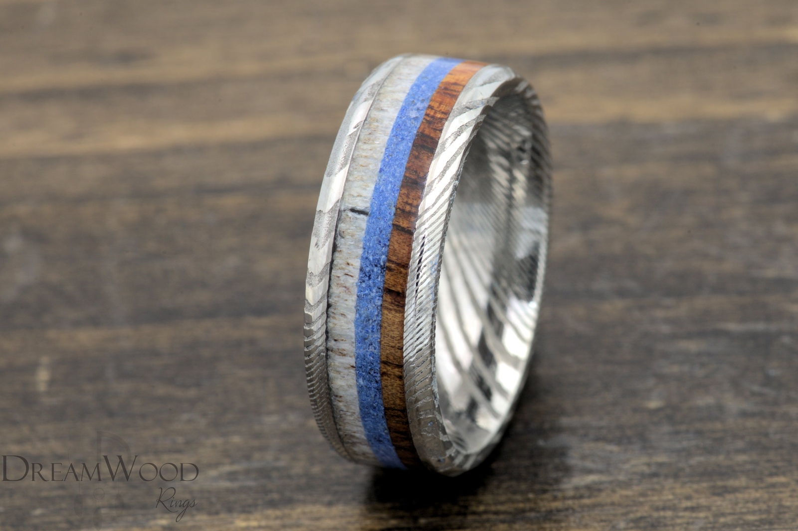 The Majestic Voyage – Damascus Steel Ring with Koa Wood, Lapis, and Antler Inlay