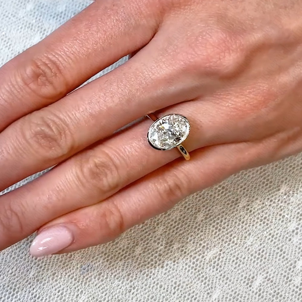 3.85Ctw Oval Moissanite Bezel Hidden Halo Engagement Ring In 14K Two-Tone Gold