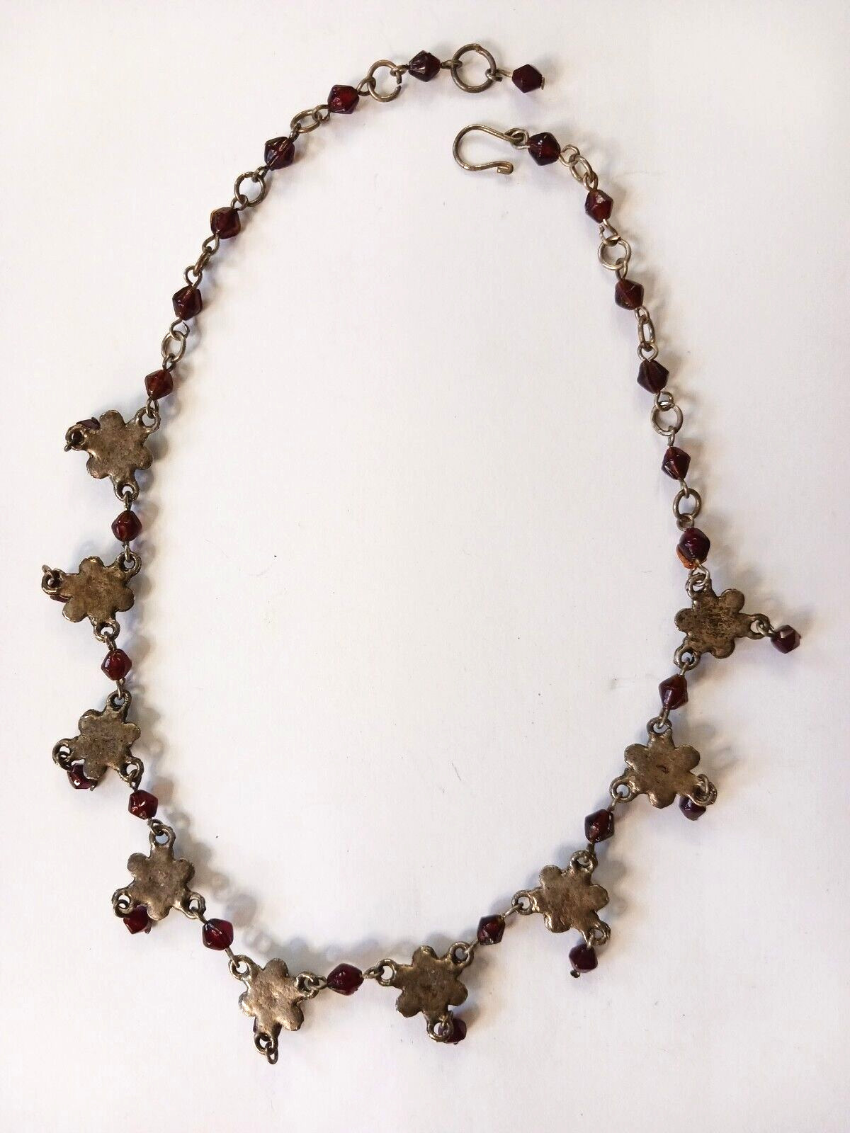 Beautiful silver tone necklace with flowers and red stones. hook clasp. Vintage