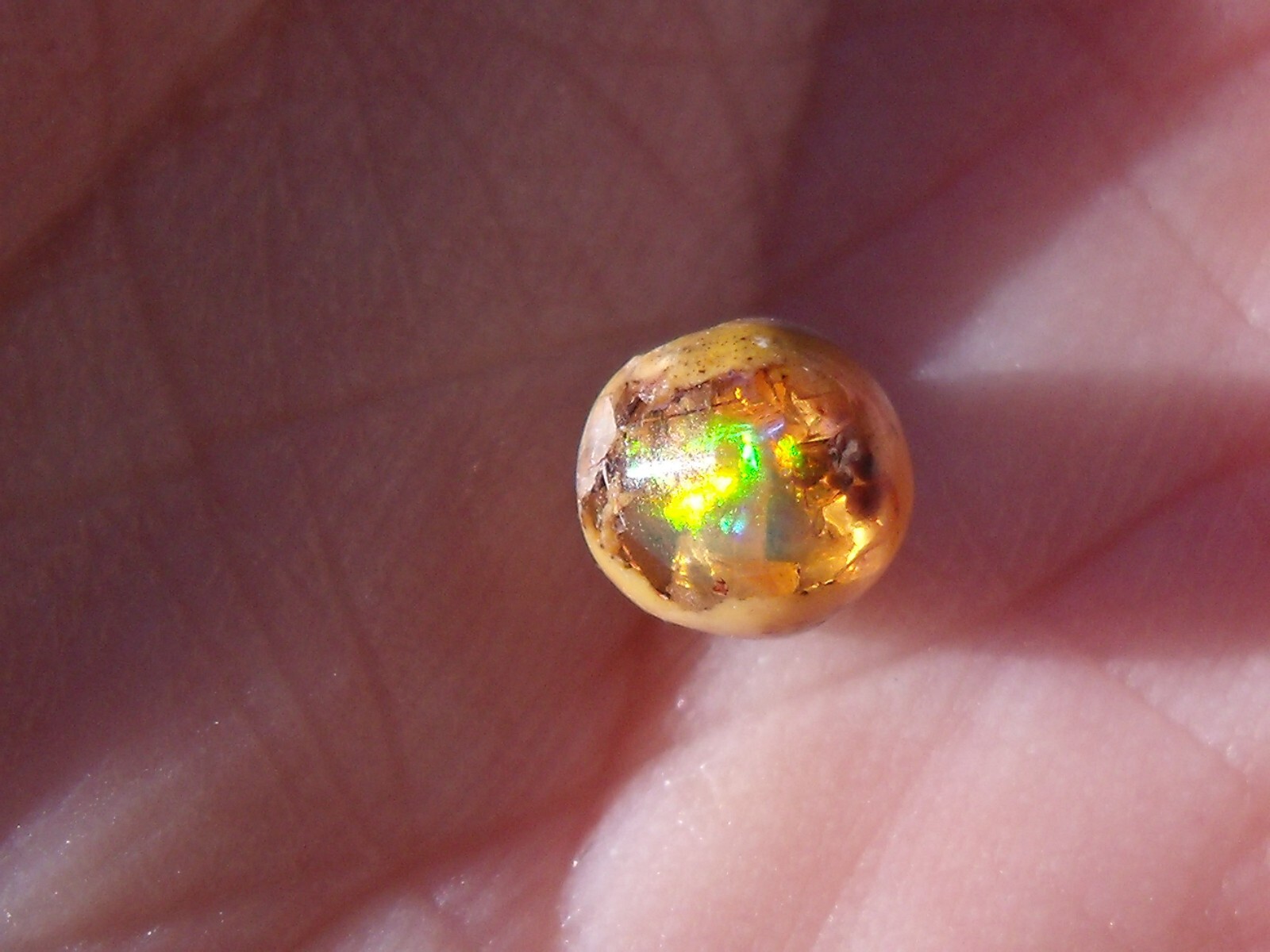 0.82 Ct. Round Cut Mexican Cantera fire opal bead.