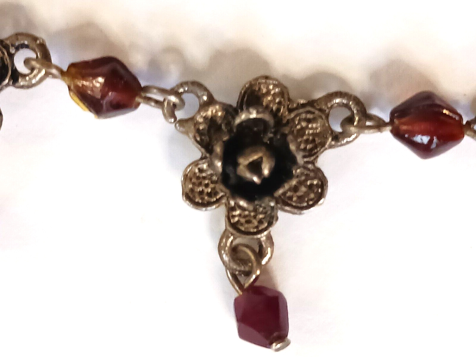 Beautiful silver tone necklace with flowers and red stones. hook clasp. Vintage
