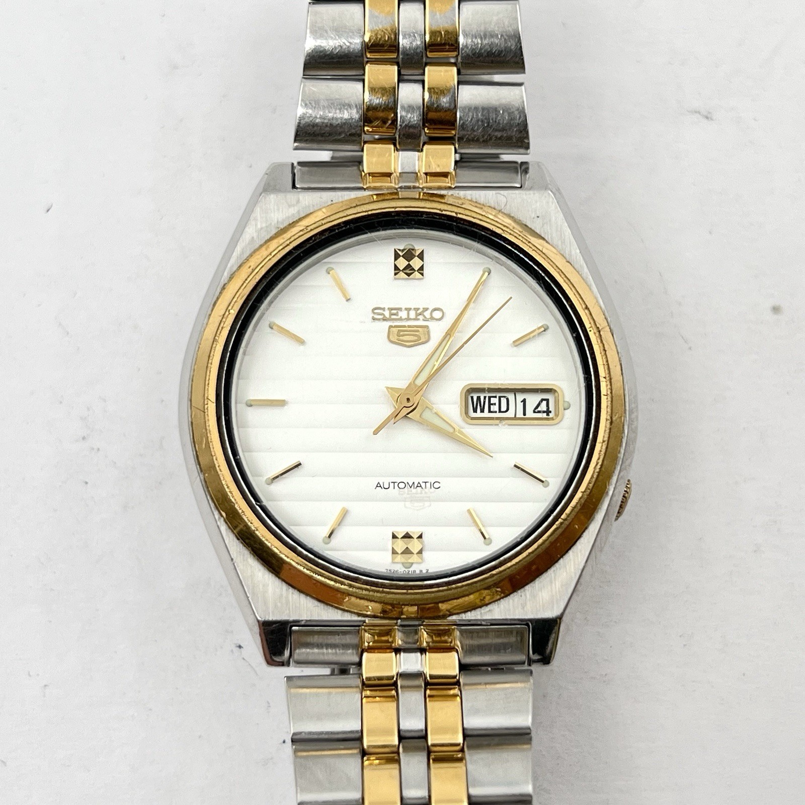 Seiko 5 Automatic Day/Date Steel Gold Tone White Teaked Dial 38mm Watch SNX166