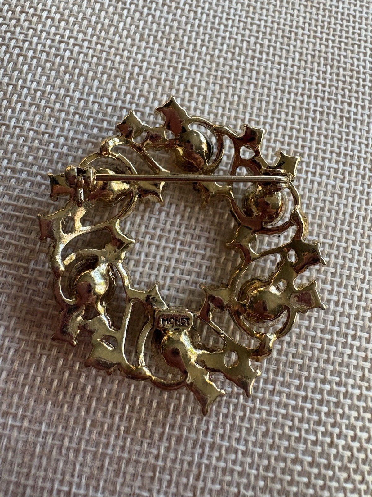 Gorgeous signed Monet multi colored jewel on open wreath goldtone