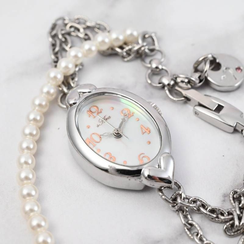 sara ladies’ wristwatch pearl bracelet watch oval shell dial heart motif silver