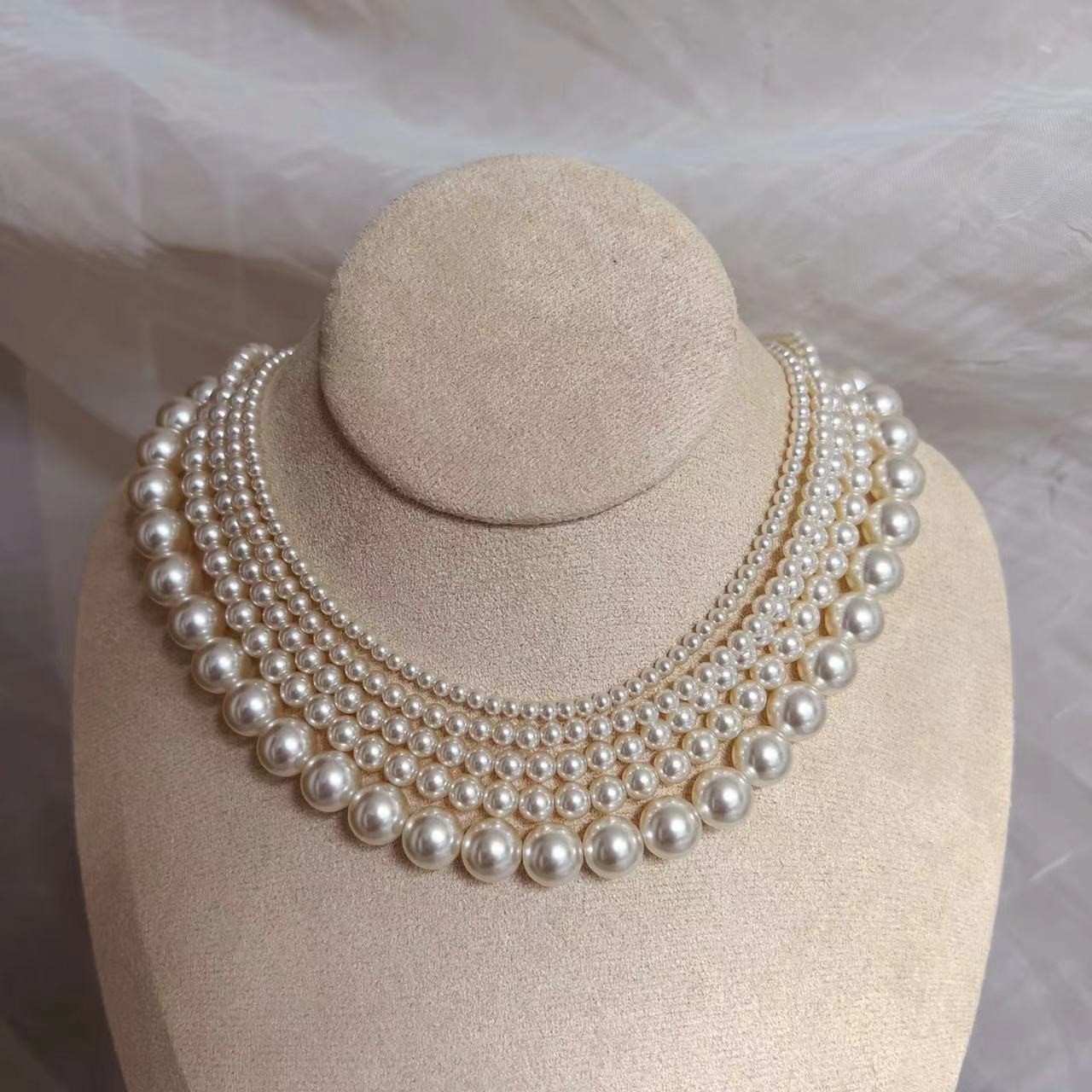 650 Warm White Perfectly Round High-Intensity Pearl Necklace