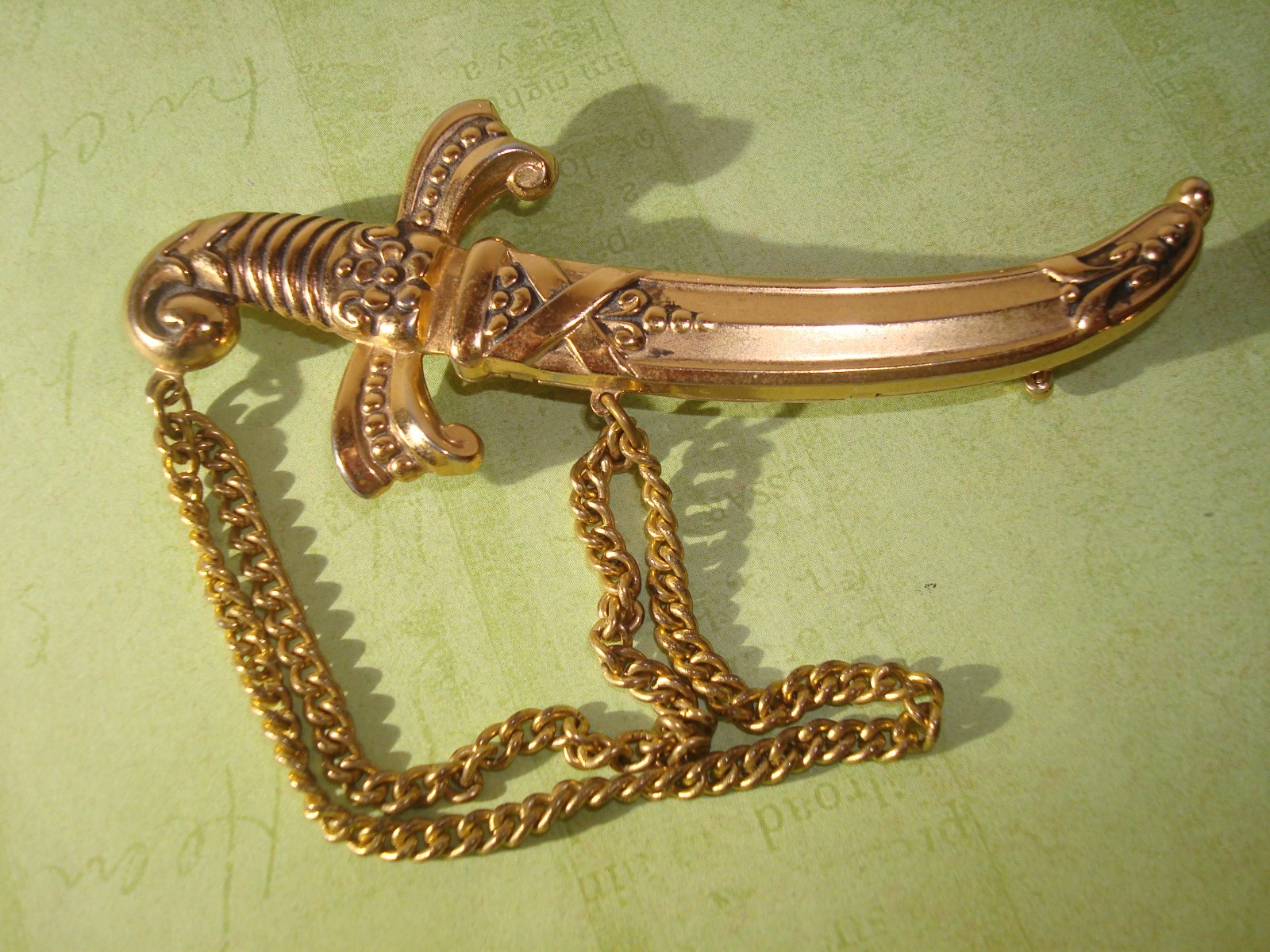 VINTAGE LOT(3) BROOCHES,CHINESE DRAGON,J.J RUSSIAN CATHEDRAL,M/EAST DAGGER PERF.