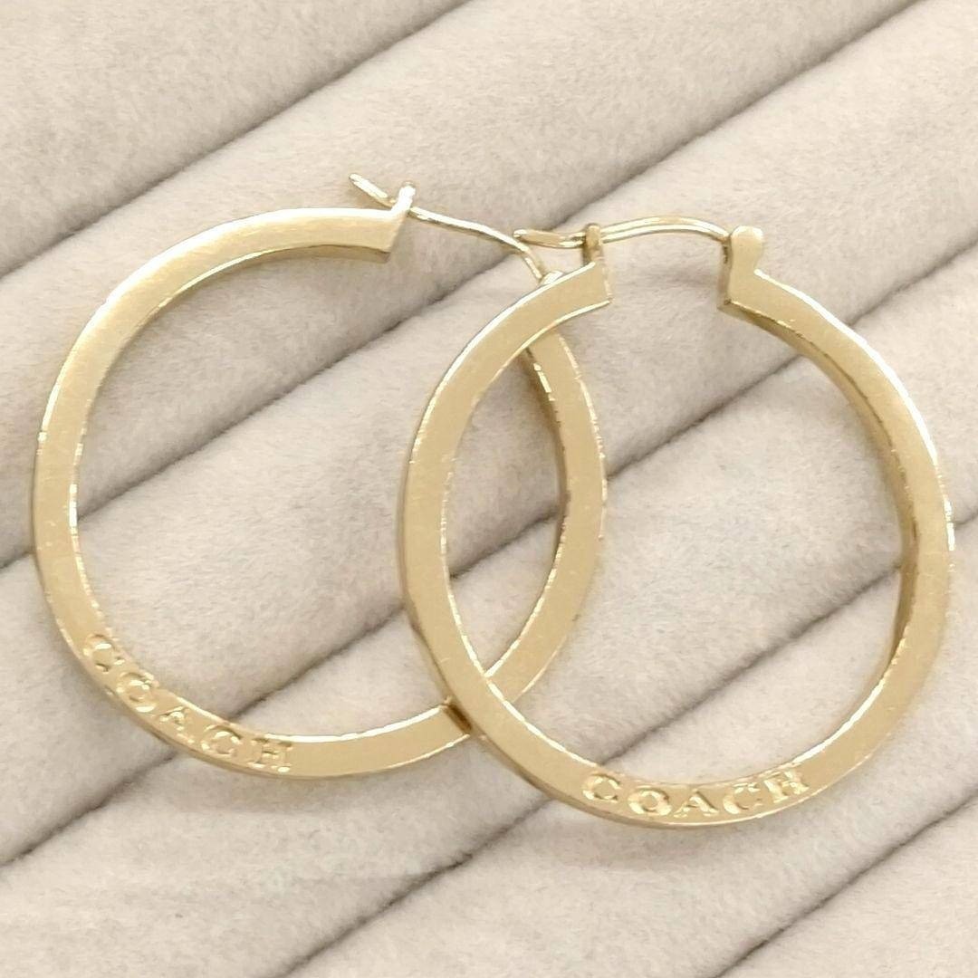Near mint COACH logo x gold large hoop earrings