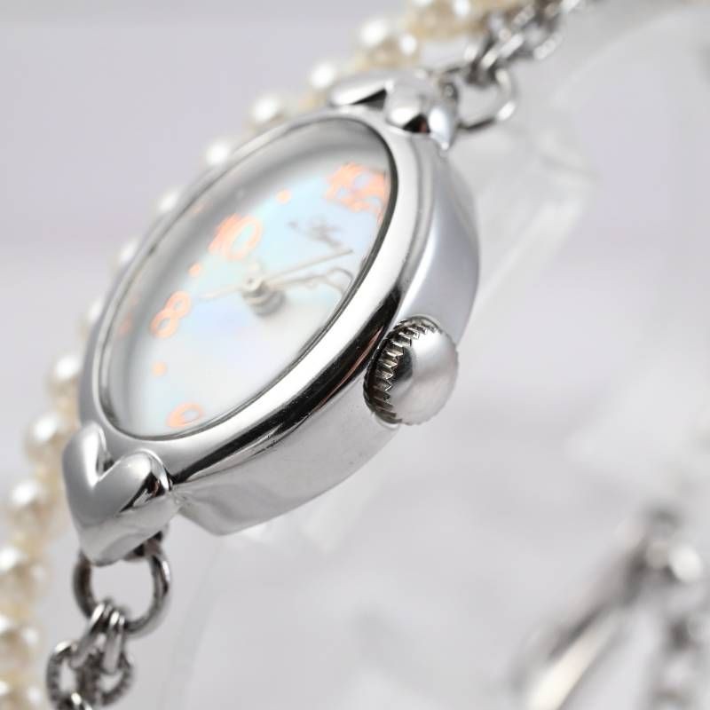 sara ladies’ wristwatch pearl bracelet watch oval shell dial heart motif silver