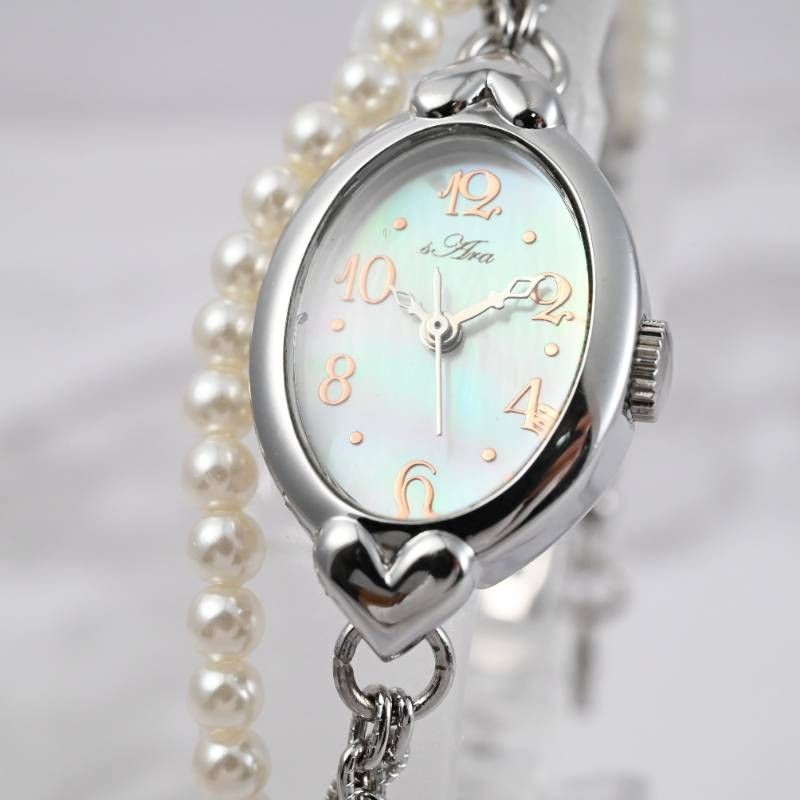 sara ladies’ wristwatch pearl bracelet watch oval shell dial heart motif silver