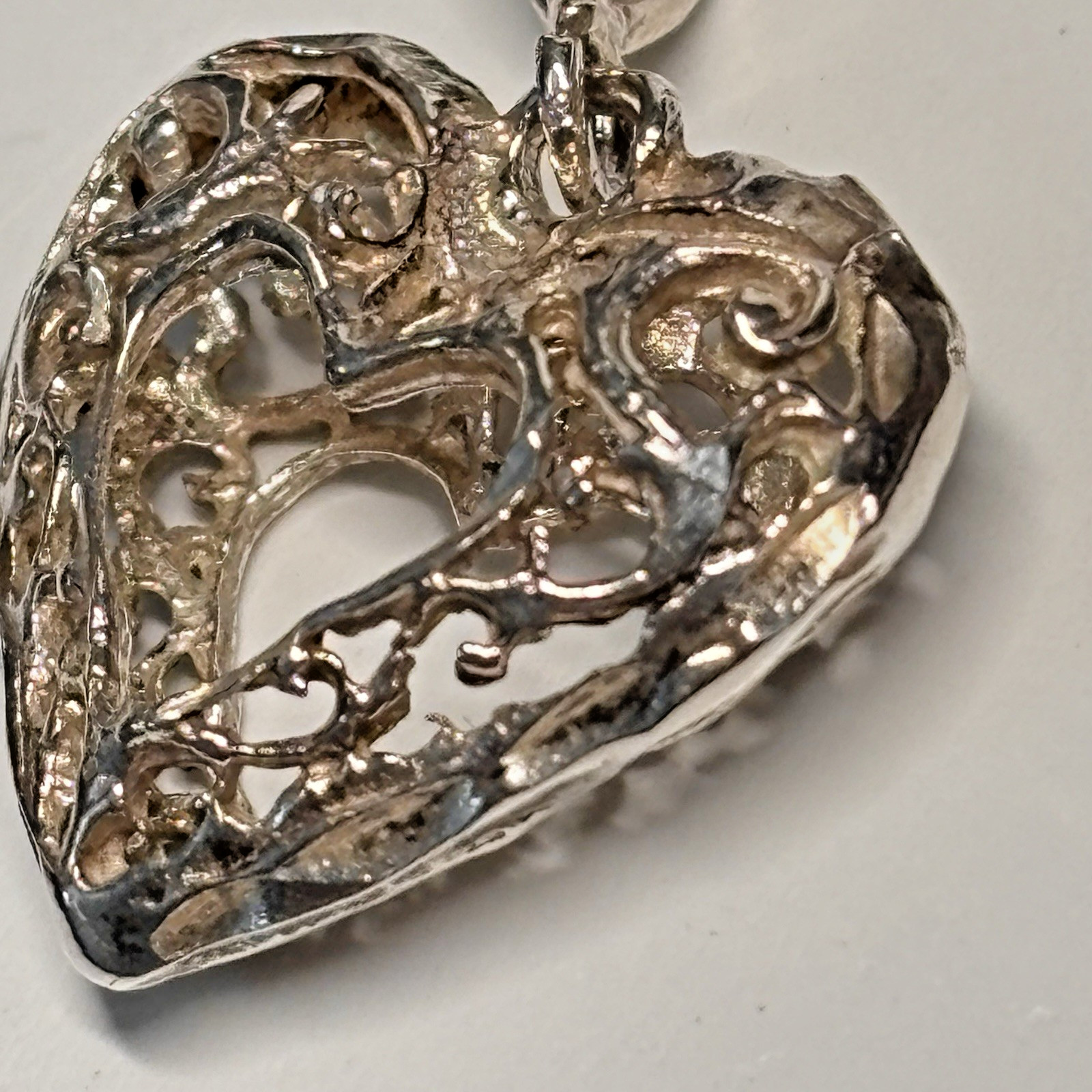 Puffy filigree heart diamond cut pendant attached bail marked STER .925 3/4 inch