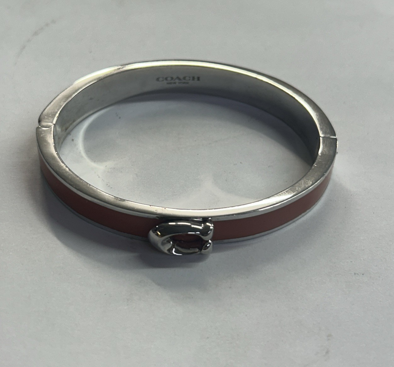 Coach Signature C Logo Hinged Bangle Bracelet in Orange Enamel & Silver