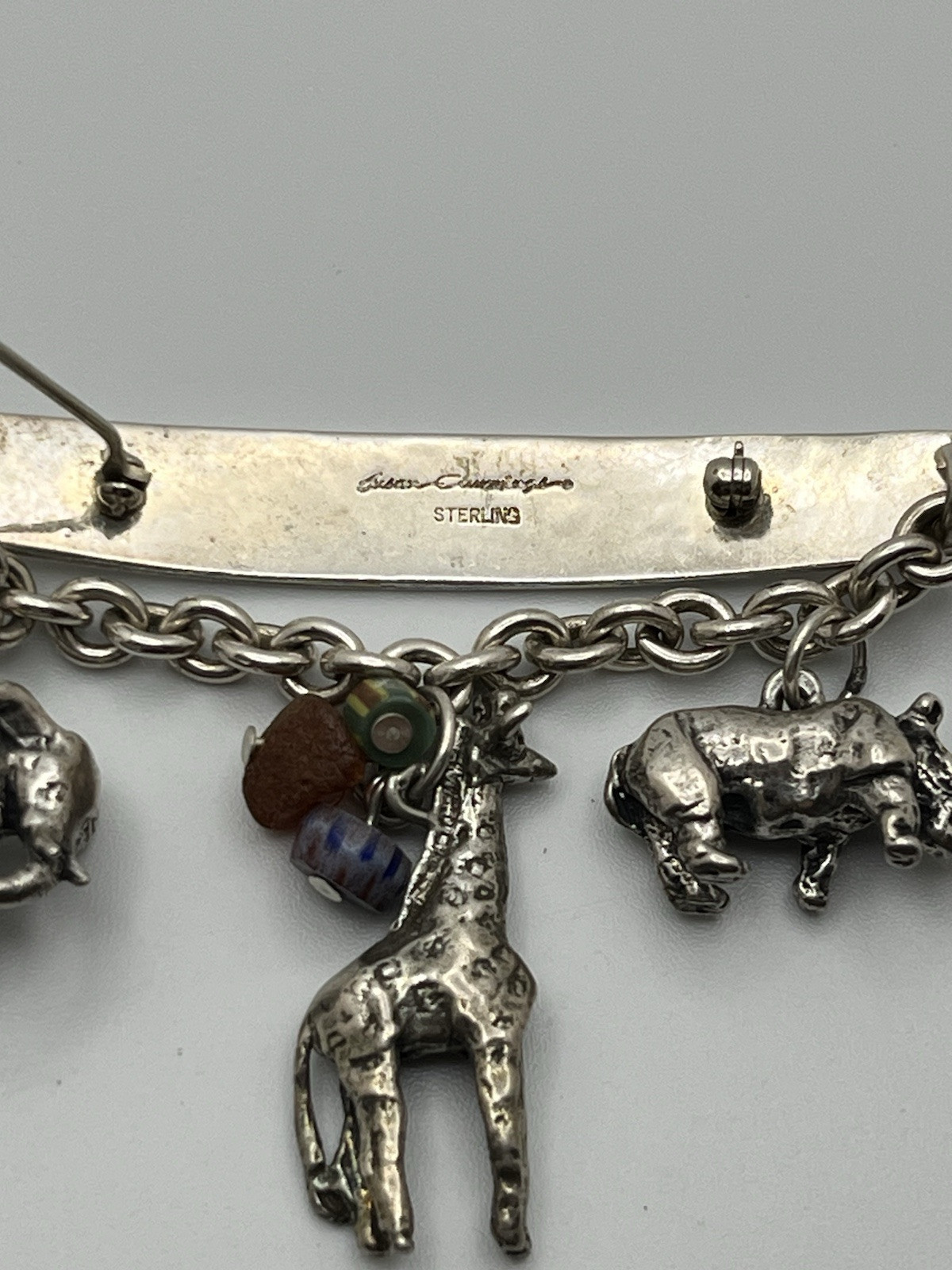 Vintage SUSAN CUMMINGs Safari Theme Sterling Silver Brooch/ Pin with charms!