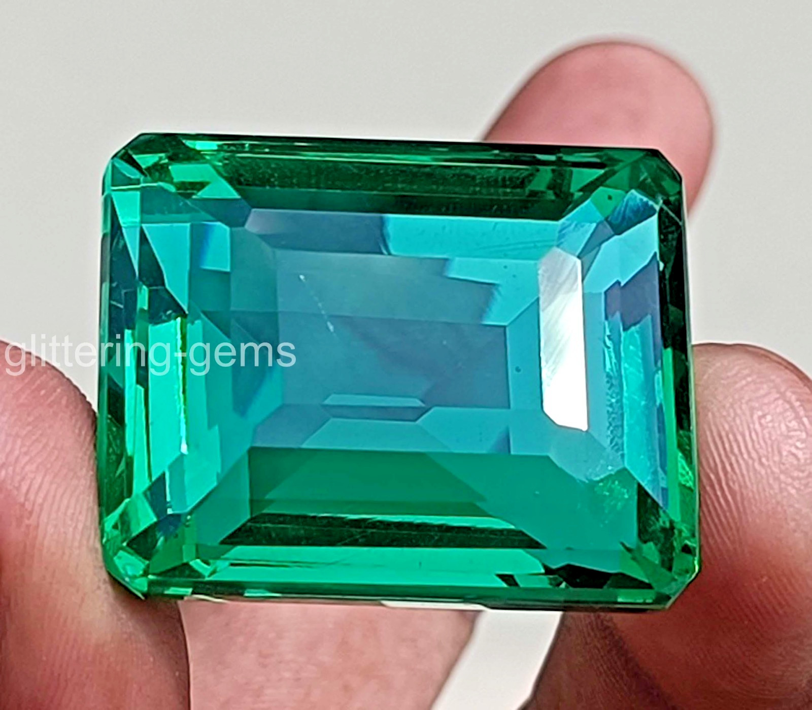 Large 103.90 Carat Natural Green Emerald 31×25 mm Certified Emerald Cut Gem 5DOE