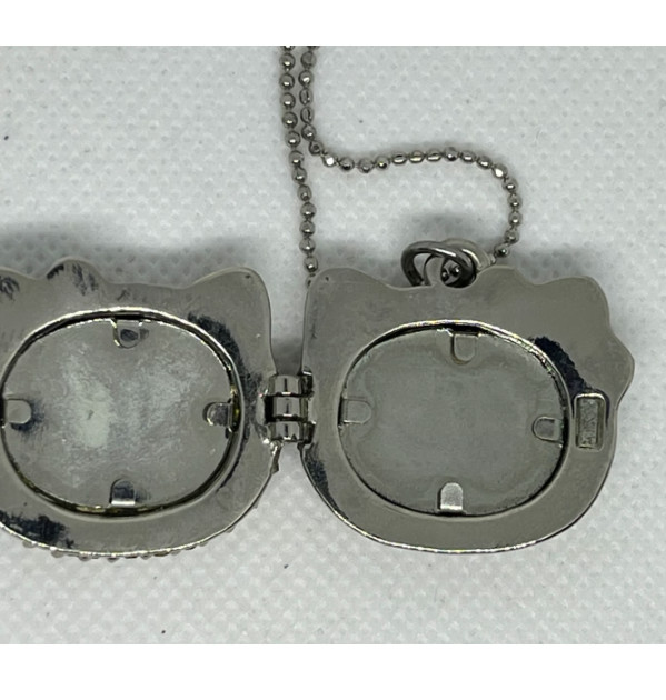 Lot of 2 hello kitty pendant/necklace, photo holder pre-owned