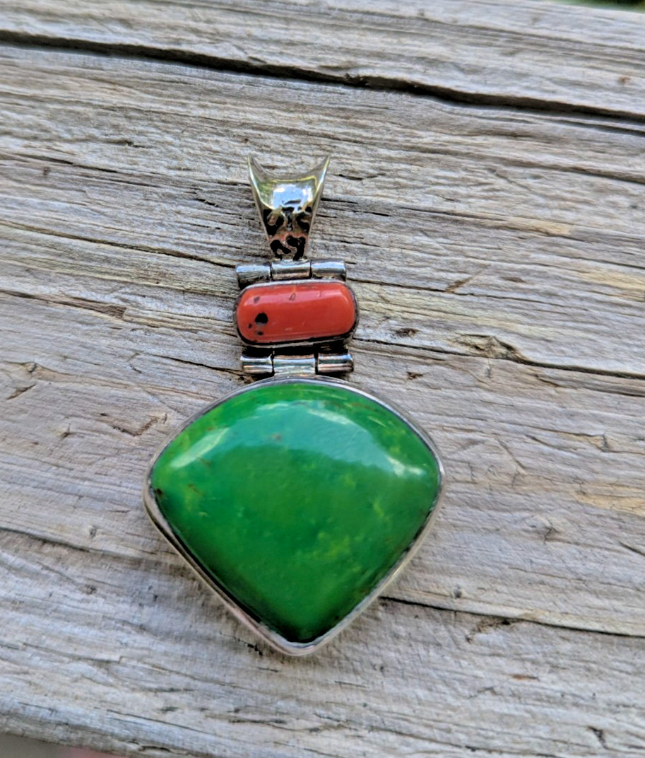 Hinged sterling green and red coral pendant resembling Navajo design