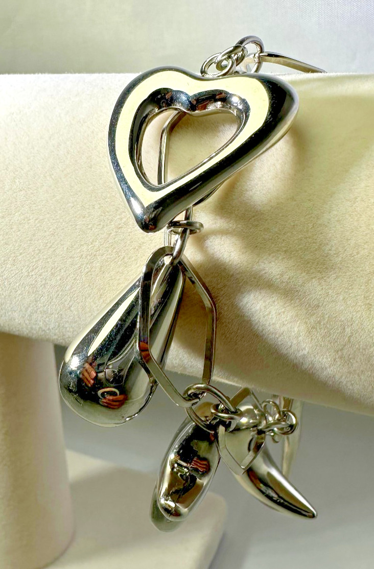 Pretty heart, moon, star Charms Bracelet stainless Steel 20.2g. 9 in.