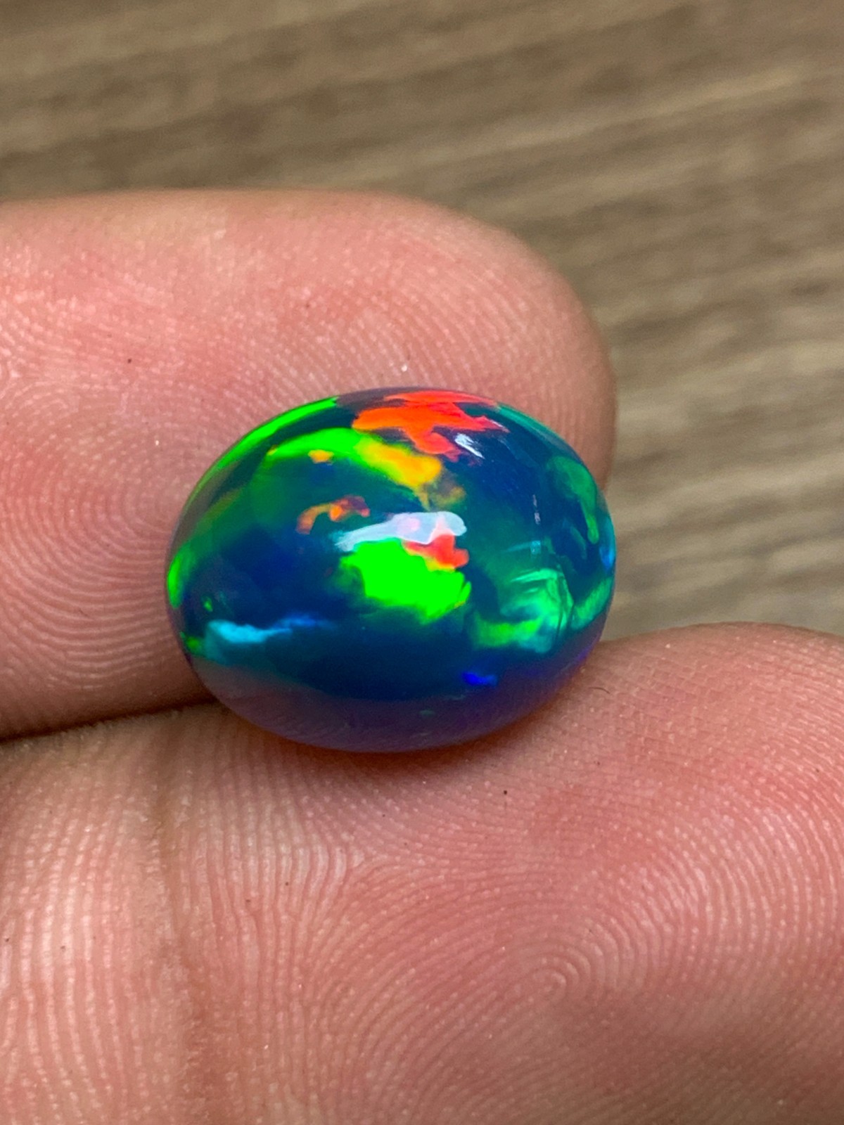 Ethiopian Opal Gemstone 6.35crt Black Oval Cabochon Rainbow Flash Welo Loose Gem