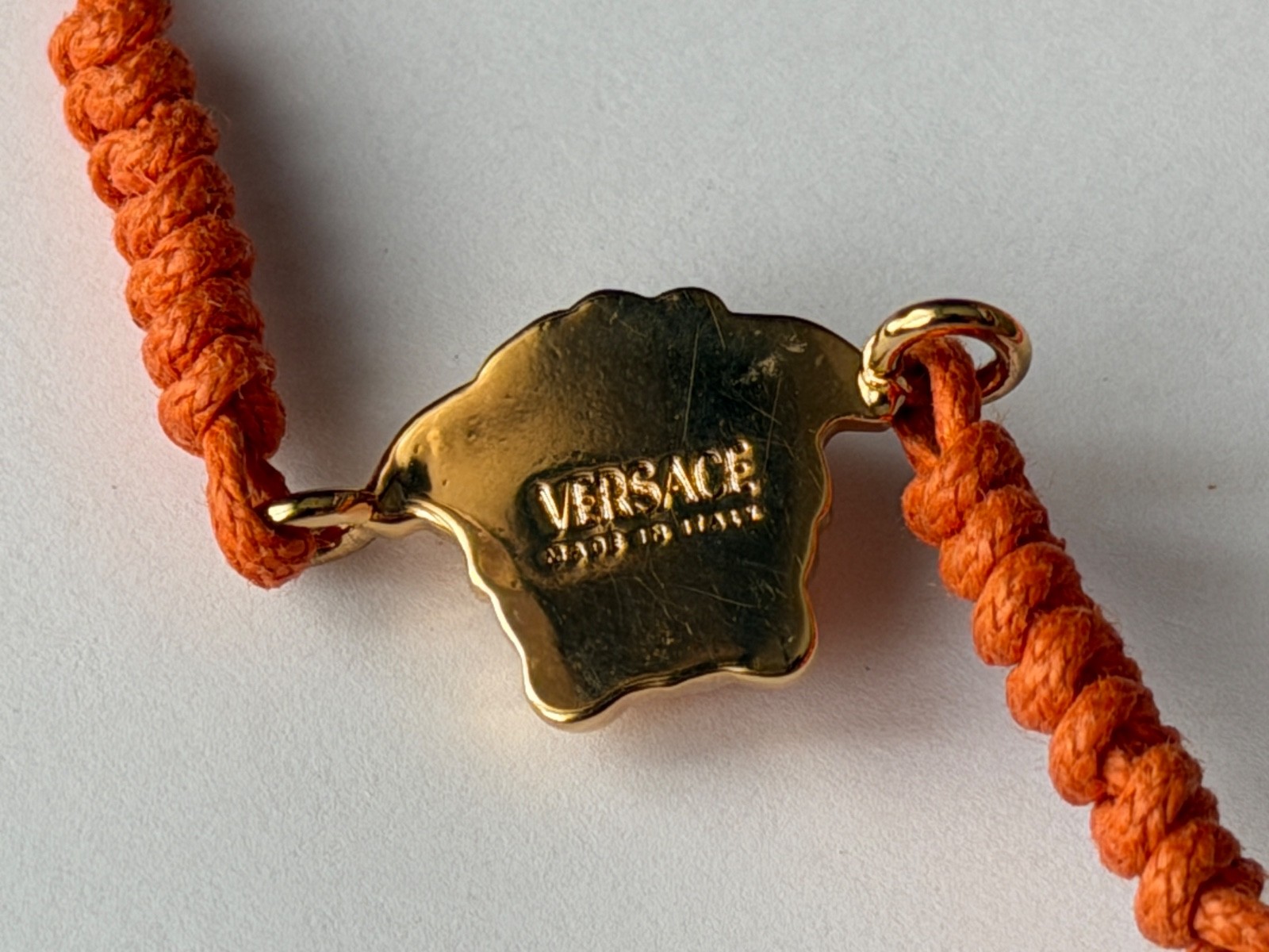 NWT Versace Medusa Head 3D Logo Charm Gold Orange Drawstring Cord Bracelet $495