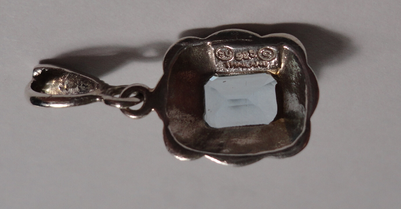 Emerald Cut Aquamarine and Diamond Accent Pendant in Sterling Silver