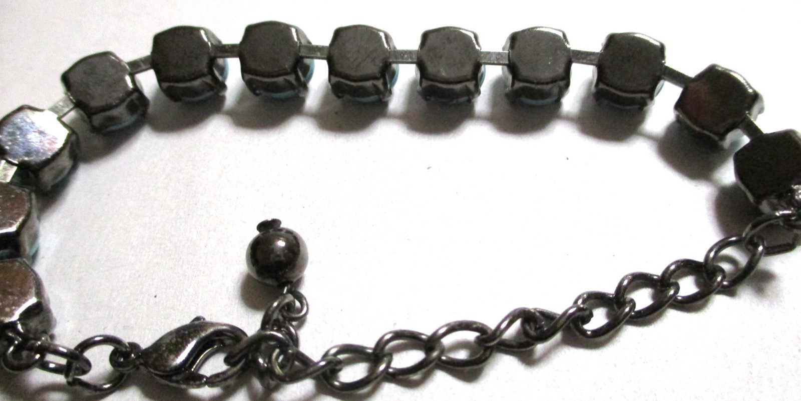 TURQUOISE BLUE HOWLITE BEADED BRACELET IN BLACK GUN METAL