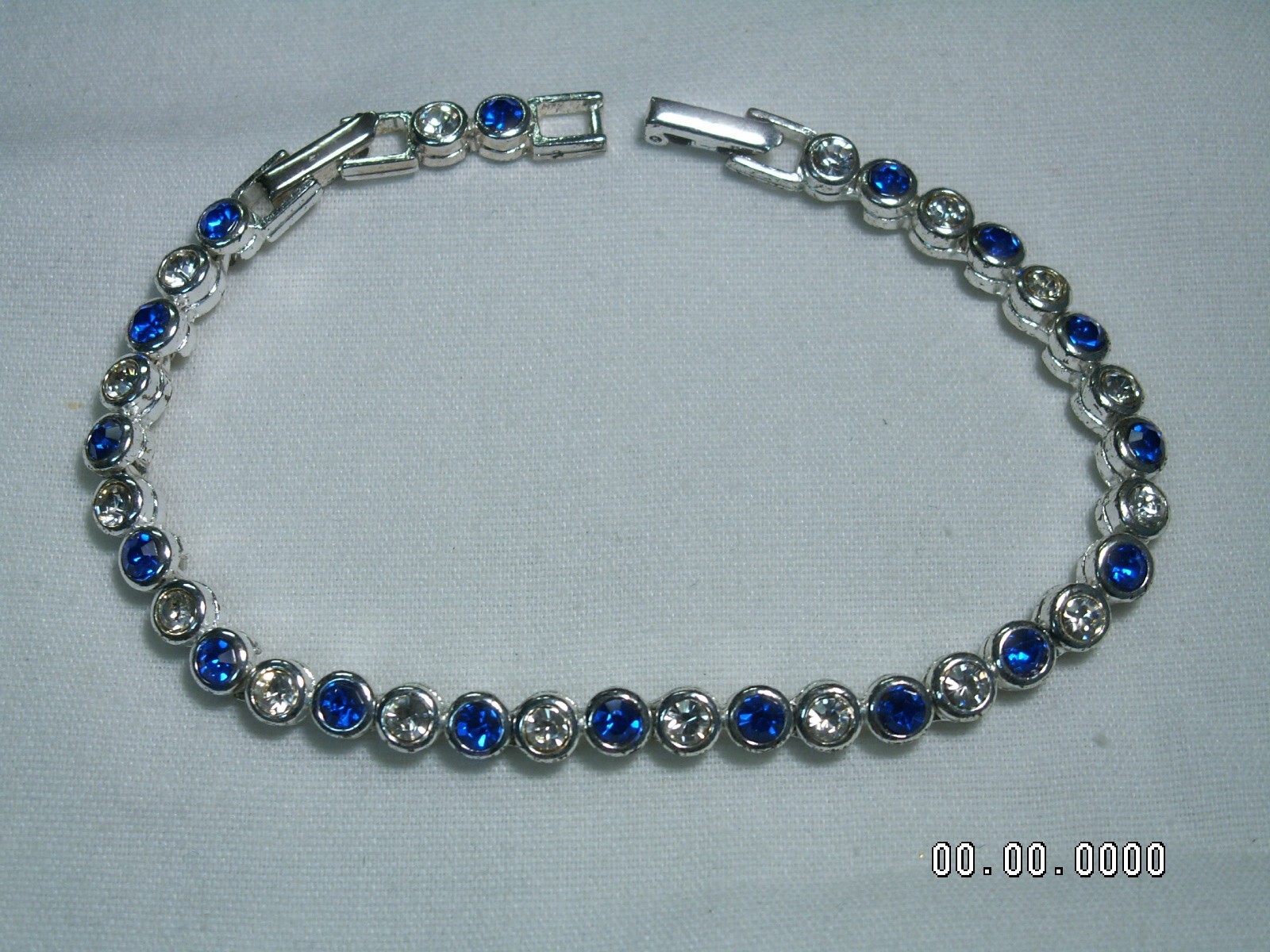 2002 AVON…Silver Tone,Sapphire Blue Crystals Bracelet & Pierced Earrings Set