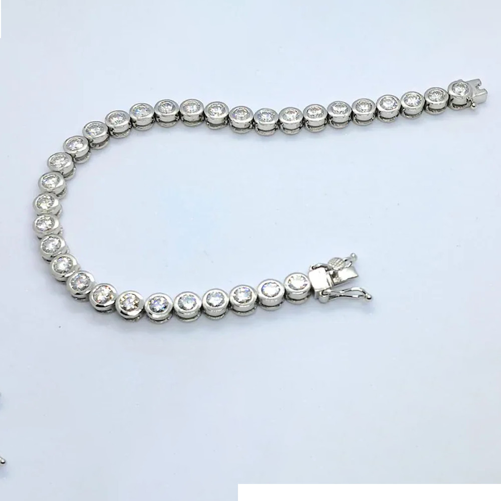 4 mm Round Cut Moissanite Bezel Set Tennis Bracelet In 14K White Gold Plated