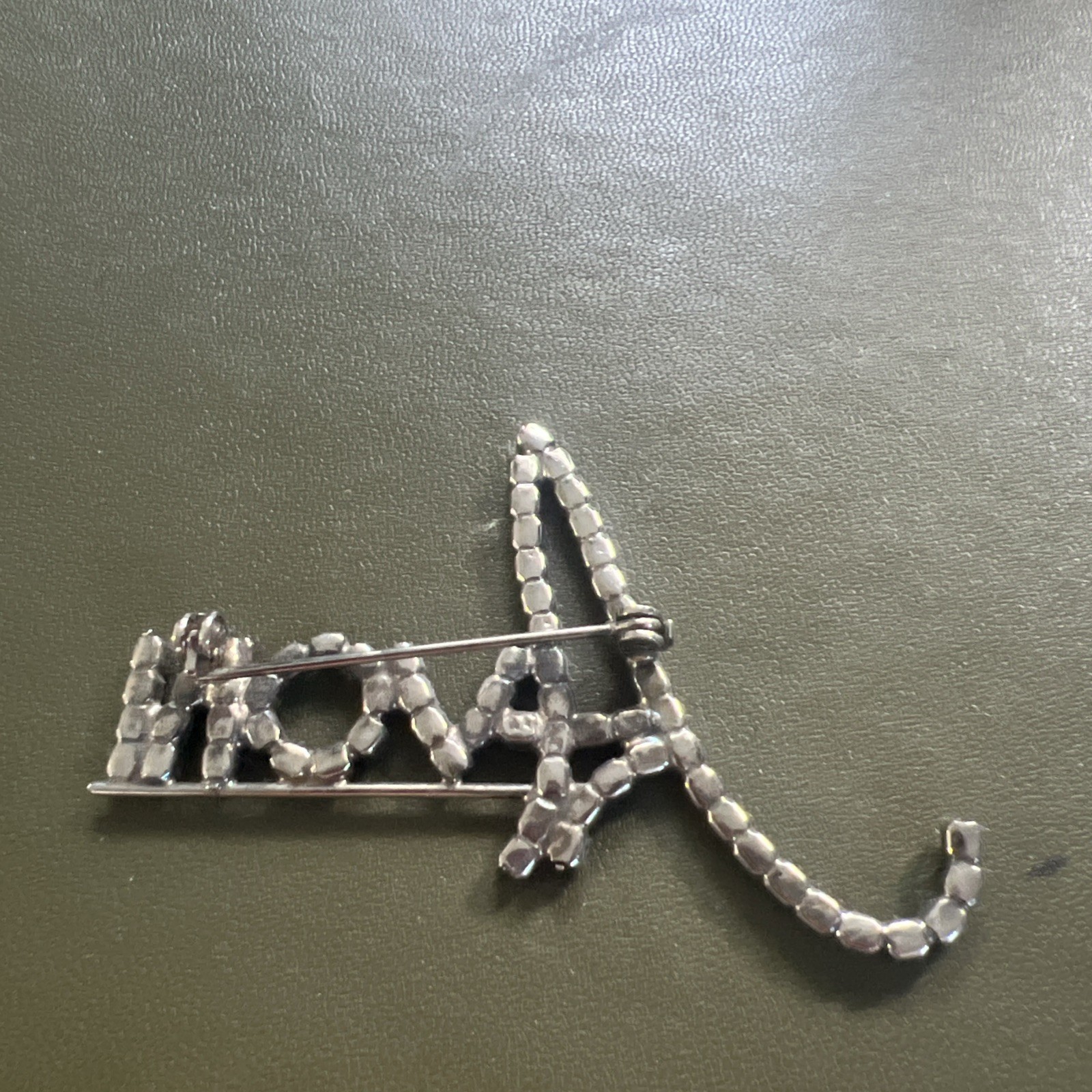 Beautiful Avon Silvertone Logo Pin (letters in Cursive) Approx. 1.75 X 2.5