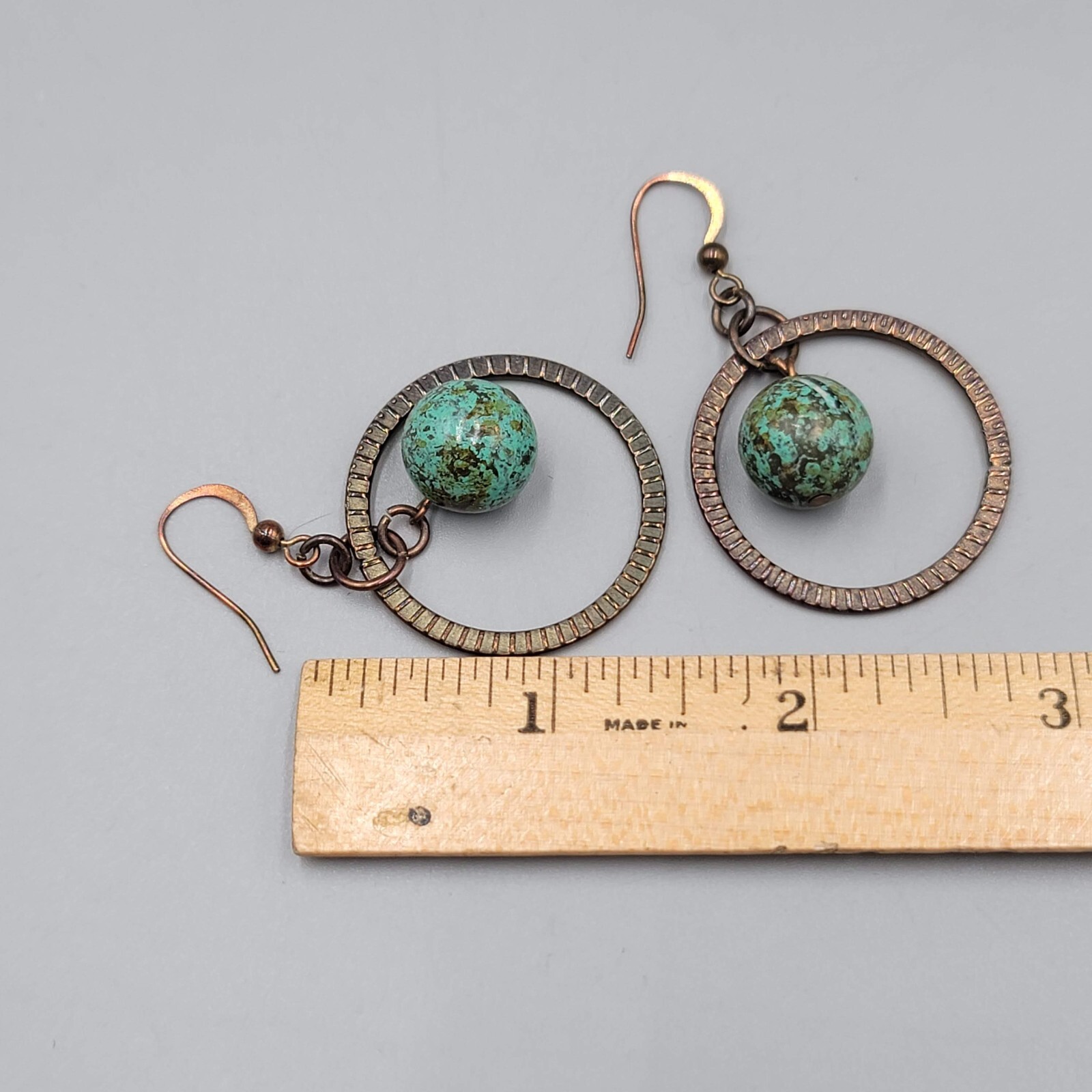 Bronze tone Dangle Pierced Earrings Green Bead Center Dangle 1.5″
