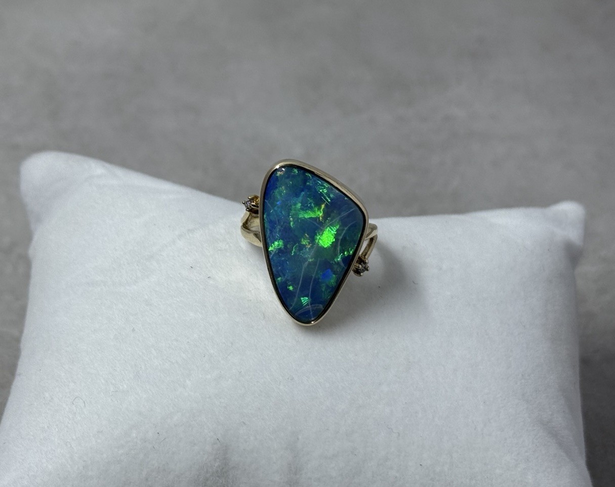 Natural Australian boulder opal with A 14k Gold ring And Diamonds. Ring size 8.