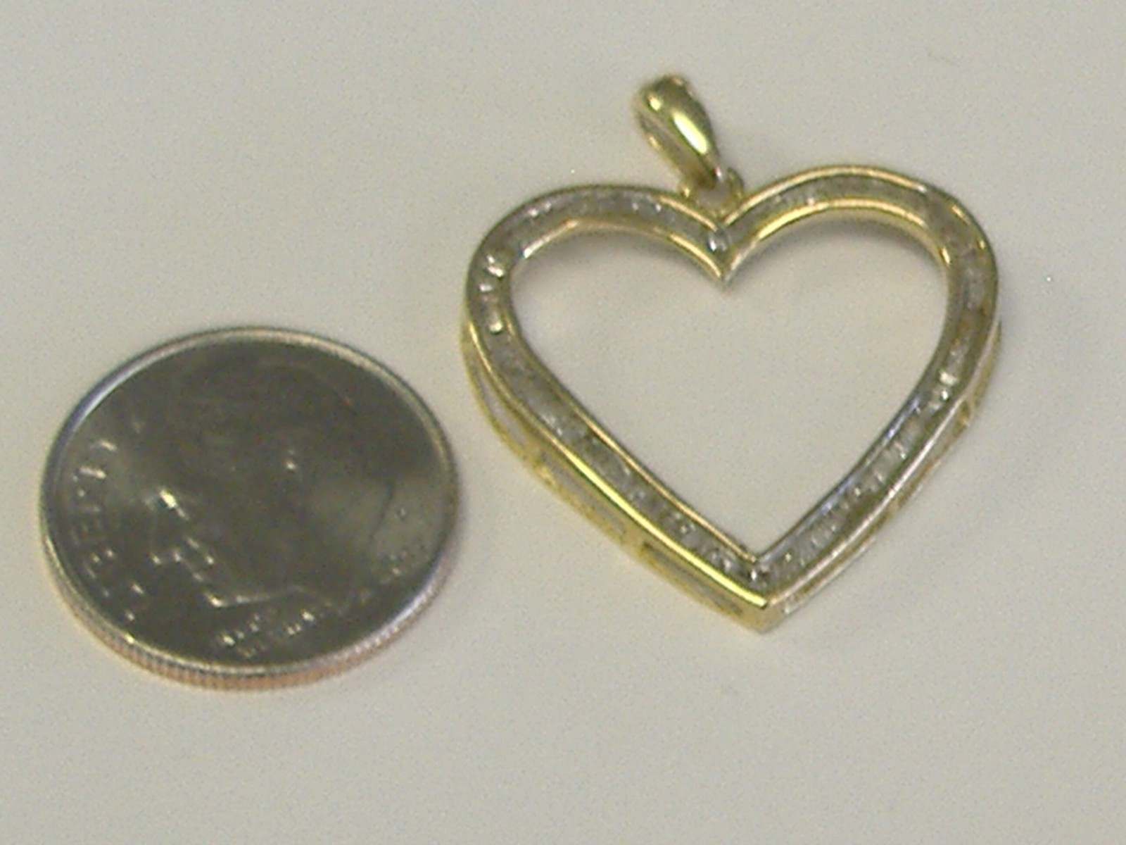 10K SOLID GOLD DIAMOND HEART BAGUETTES PENDANT APPROX. 1 CT TW. SIZE 23MM X 27MM