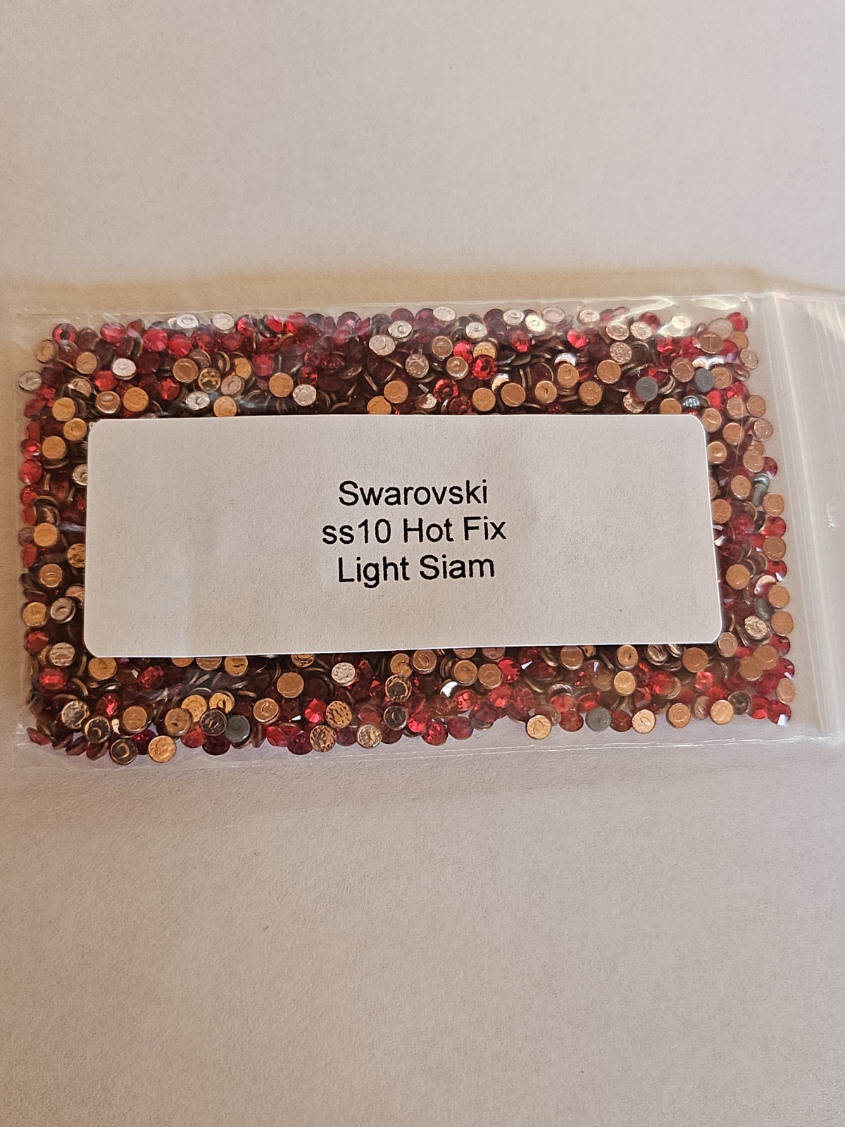 Genuine Swarovski ss10 Hot Fix Crystals in the color LIGHT COLORADO TOPAZ