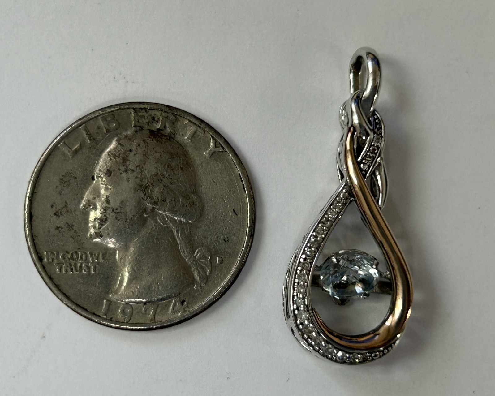 (MA6) OTC 925 / 14k “Rhythm of Love” Diamond Infinity Knot Pendant w/ Blue Topaz