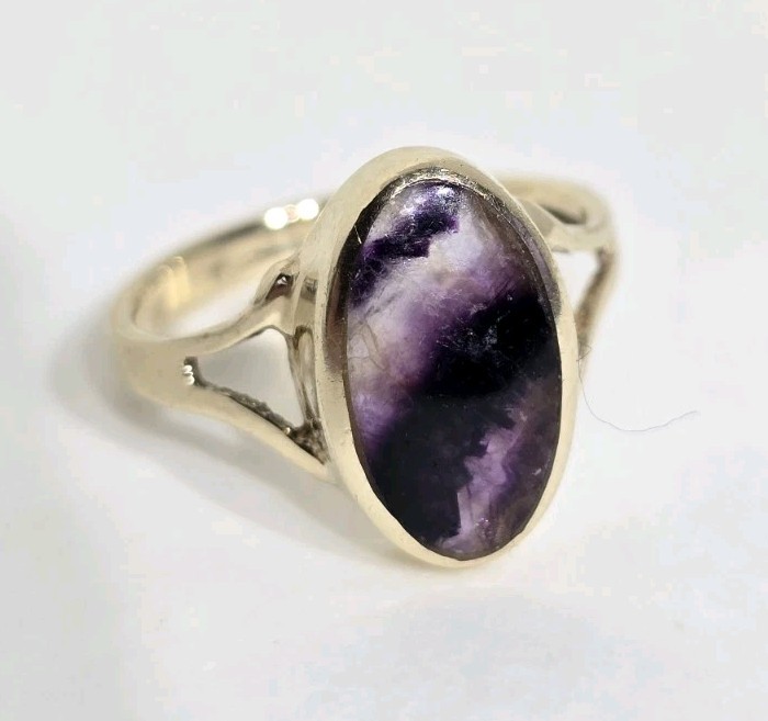 9ct Yellow gold open work ring. Collet set with an oval Blue John Cabochon.