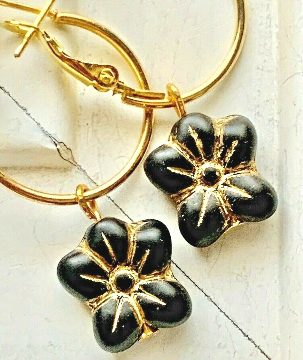 Beautiful Etched Black and Gold Flower Hoop Earrings.