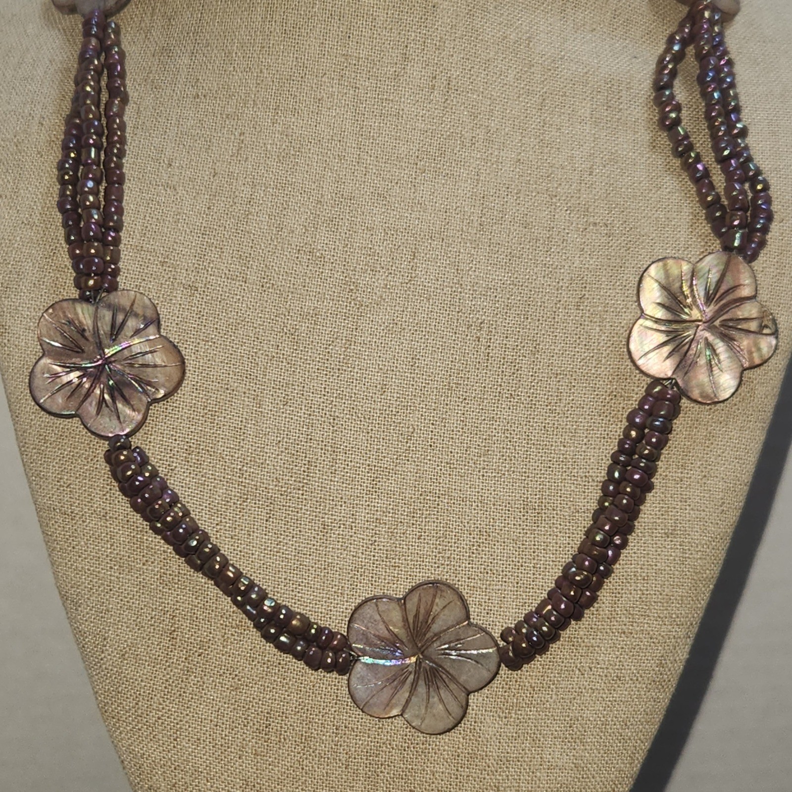 Iridescent Mauve Multi Strand Seed Bead Necklace Carved Shell Flower Toggle 21in