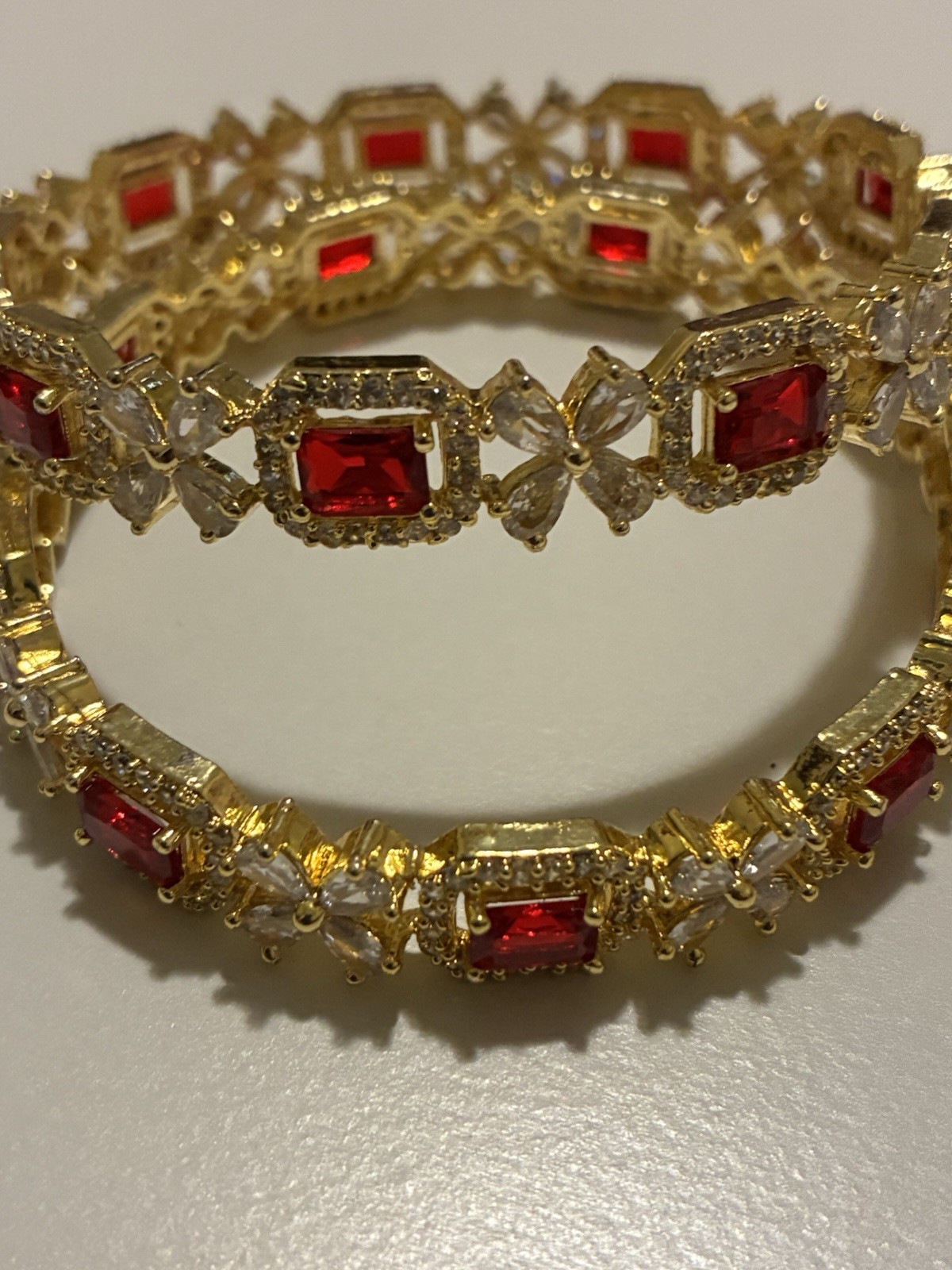Gold Tone Bangle Bracelets Set with Red Emerald Cut and White Round Stones