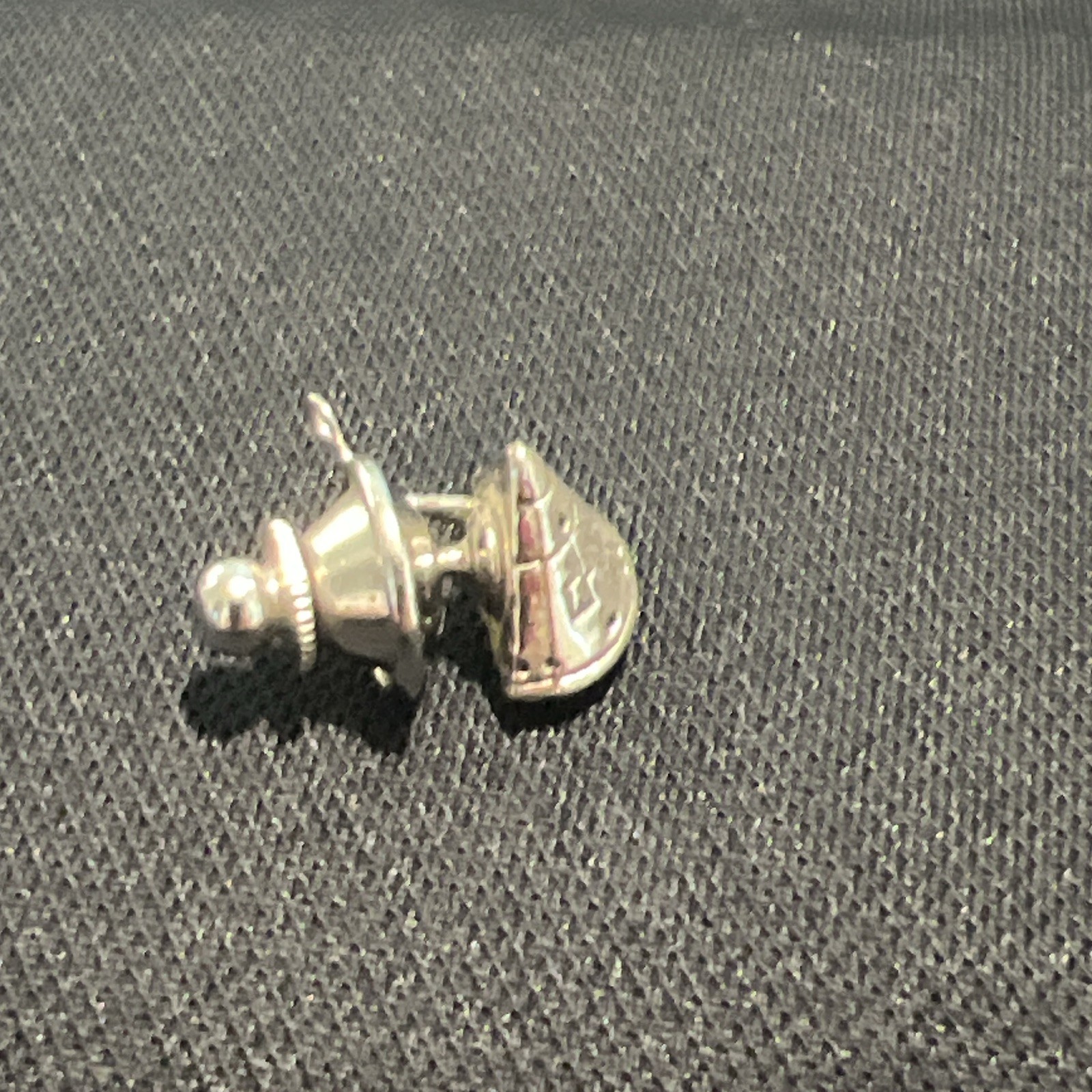 Vintage silver-tone lapel pin or tie tack NASA Apollo-style space capsule