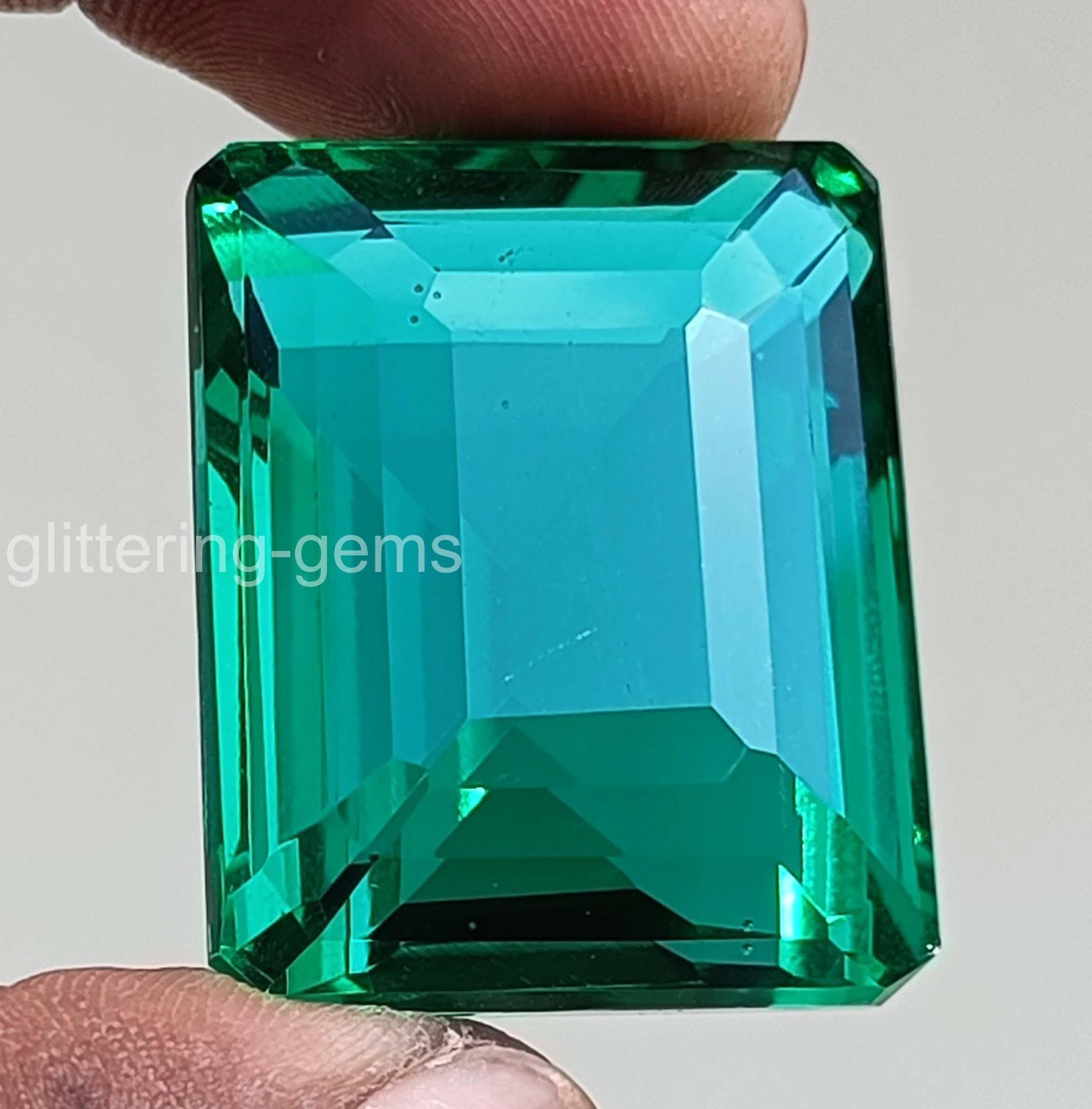 Large 103.90 Carat Natural Green Emerald 31×25 mm Certified Emerald Cut Gem 5DOE