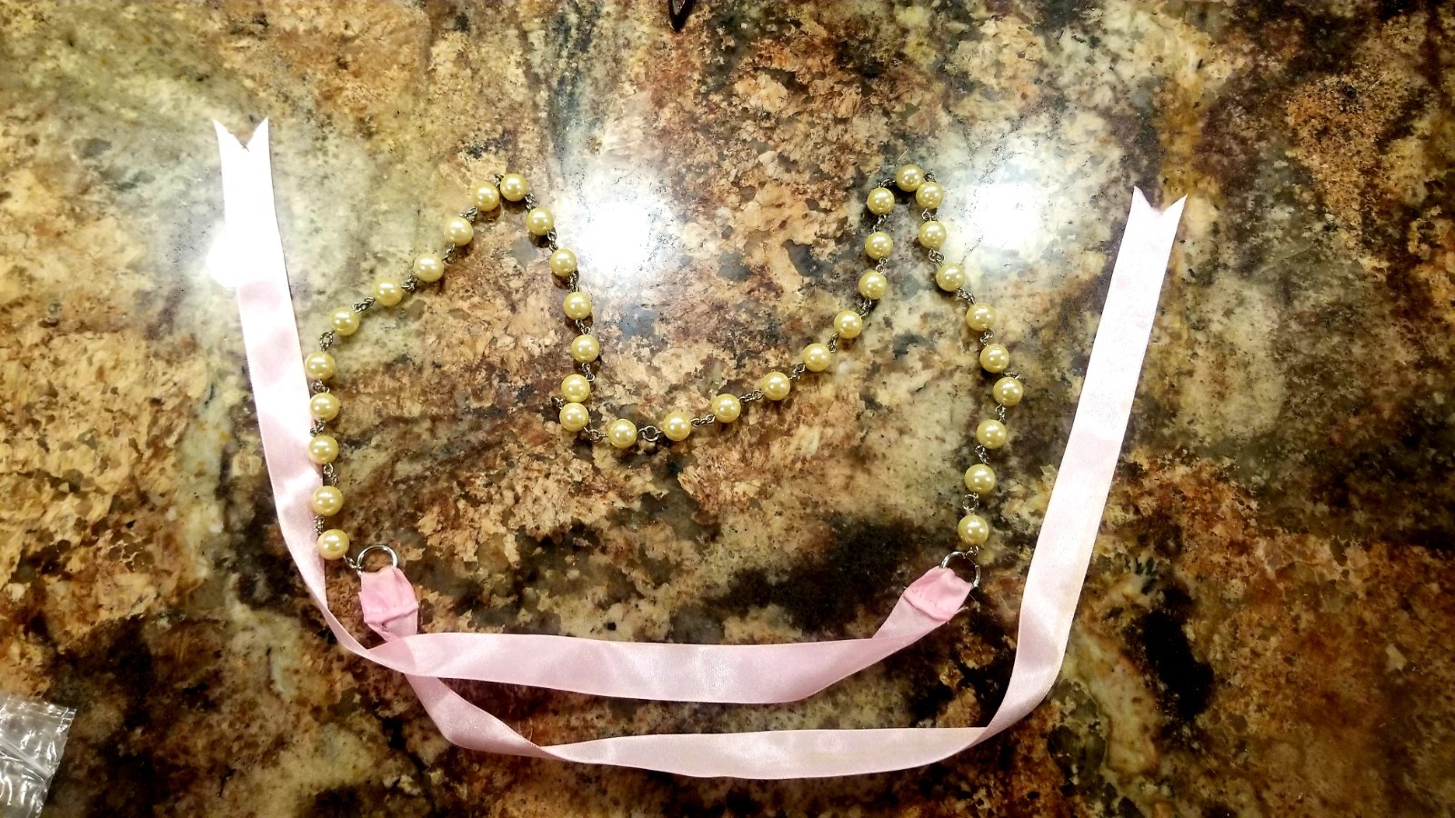 Strand of old fashioned 1960s Pearl’s with pink silk ribbon necklace/belt