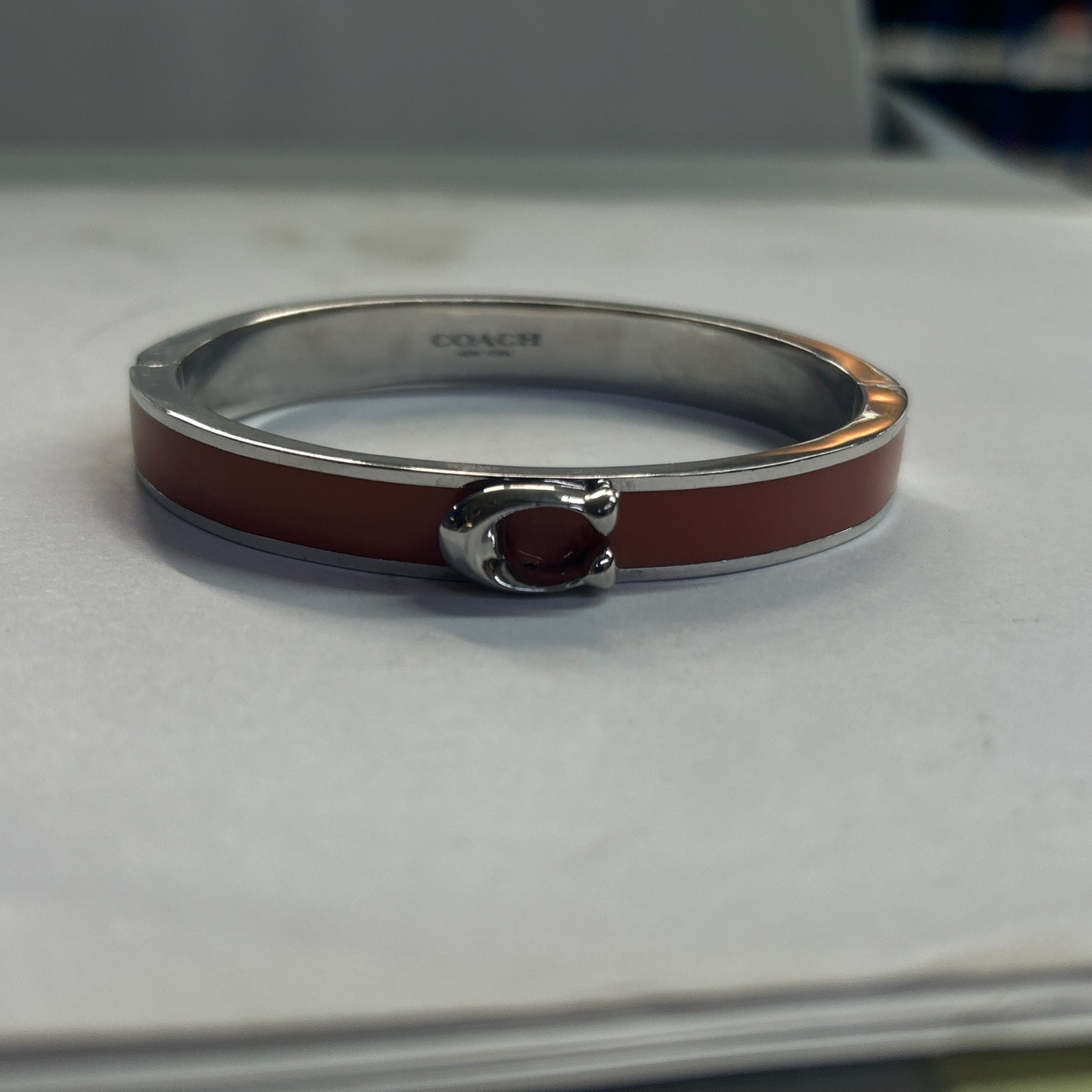 Coach Signature C Logo Hinged Bangle Bracelet in Orange Enamel & Silver