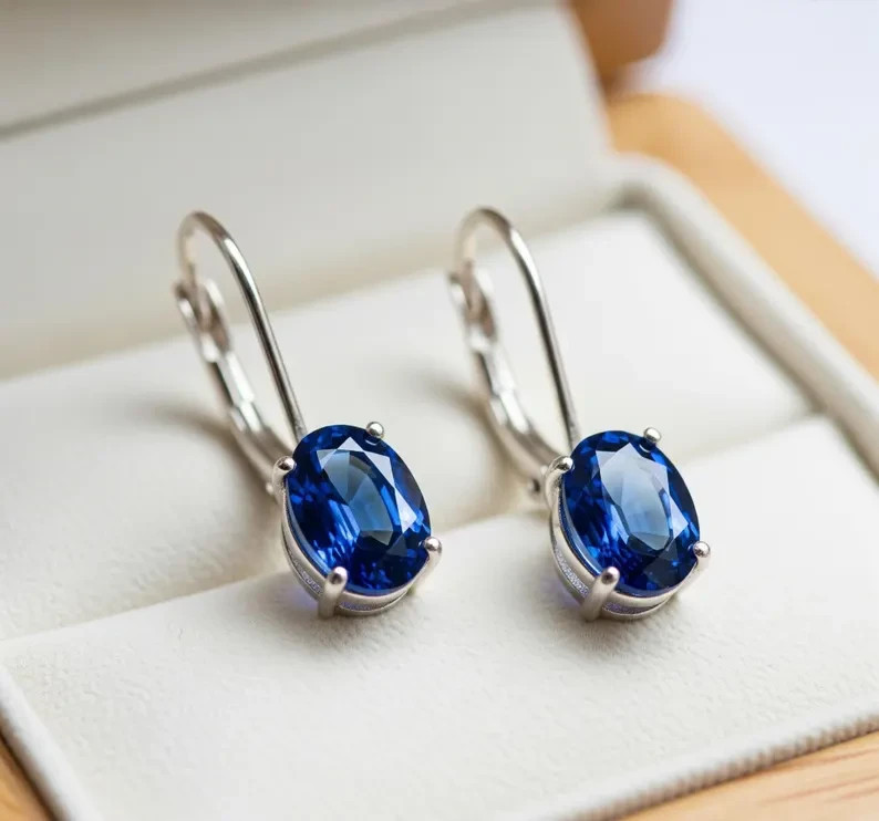 Stunning Lab-Created Oval Sapphire Lever Back Earrings in Sterling Silver