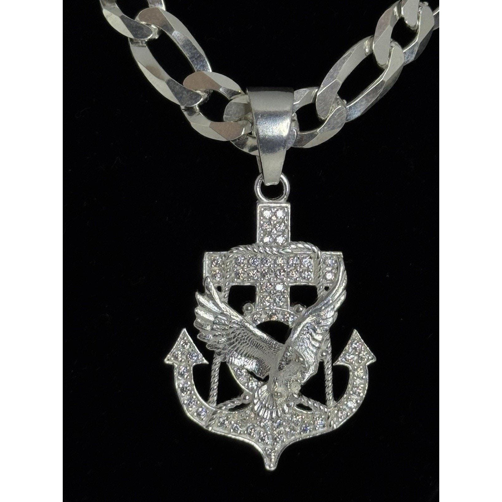 Cadena fígaro con dije de águila, en cruz de ancla plata 925