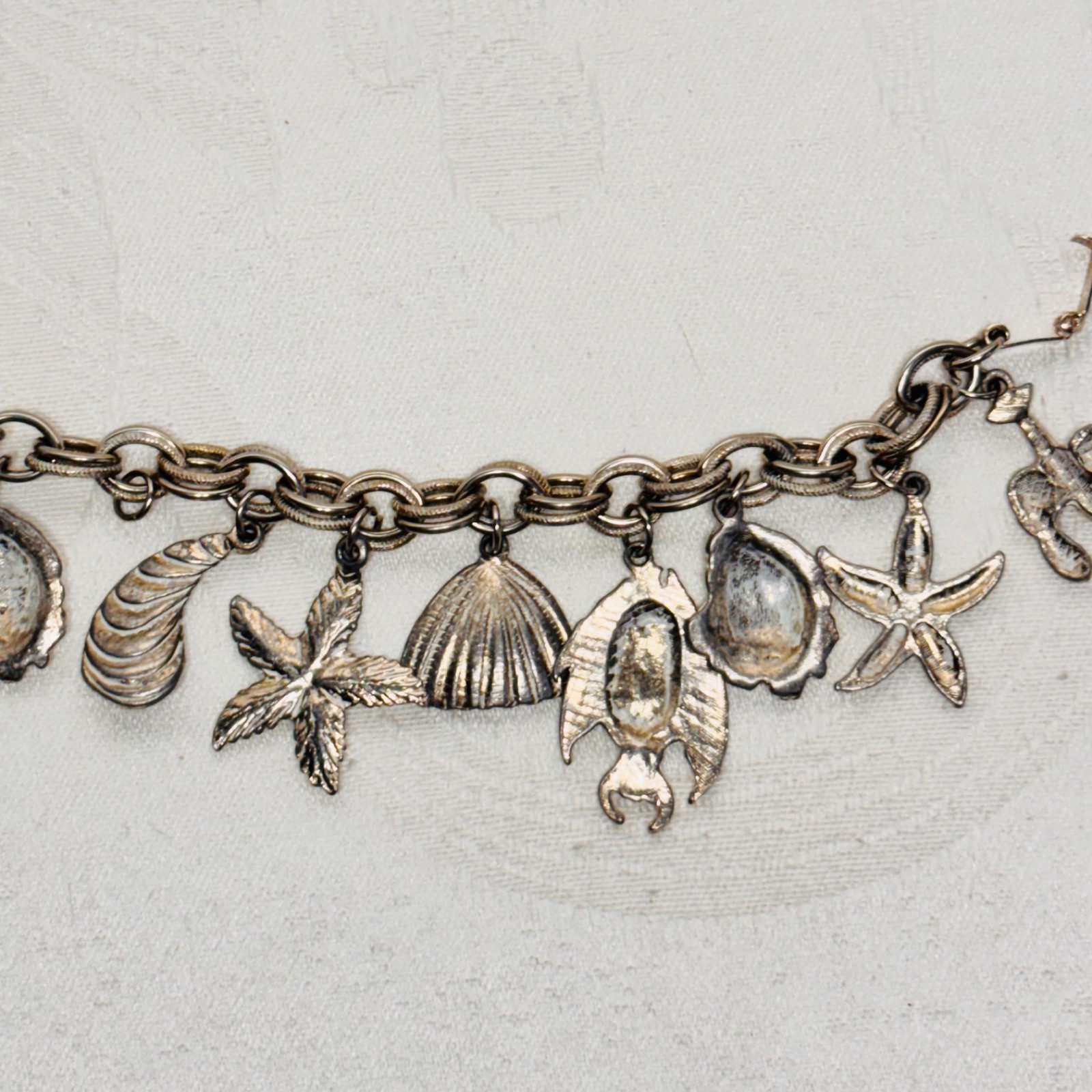 BRACELET ocean life charms starfish shells fish lobster fold over clasp vintage