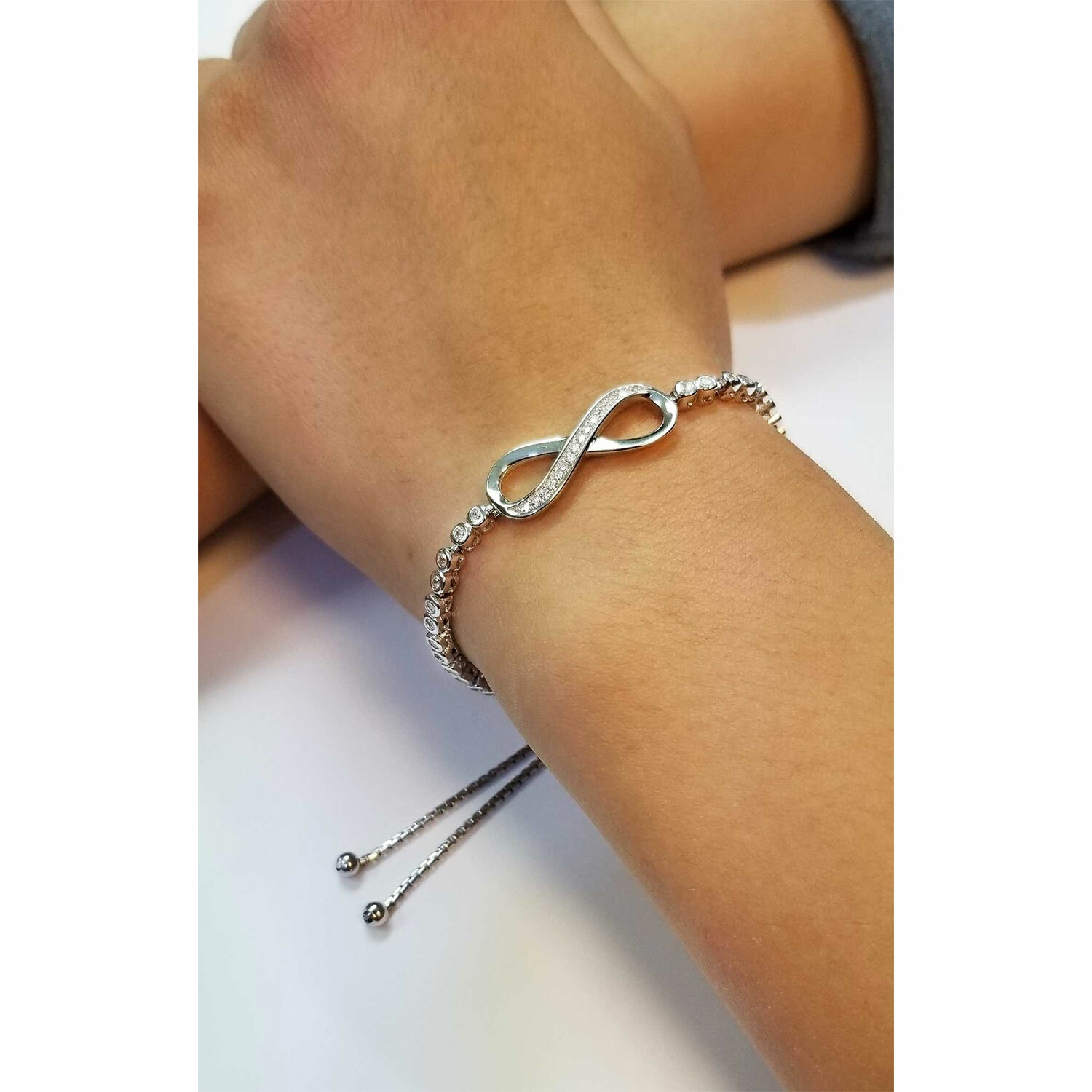 Sterling Silver CZ Infinity Bracelet with Bezel Set Adjustable Drawstring Clasp