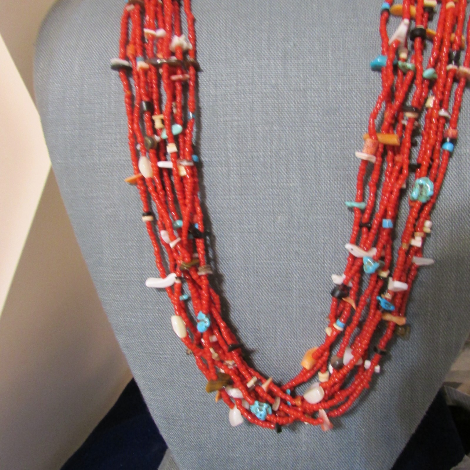 VINTAGE SOUTHWEST N.A, 10 STRAND CORAL NECKLACE, WITH ASSORTED FETISHES