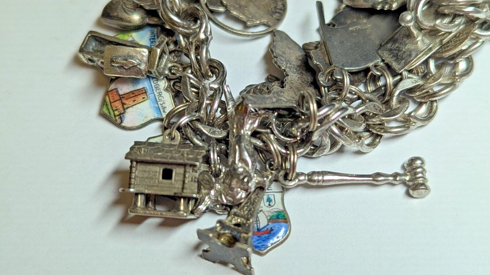 VINTAGE STERLING SILVER CHARM BRACELET WITH ABOUT 35 CHARMS WEIGHS 94.4 GRAMS
