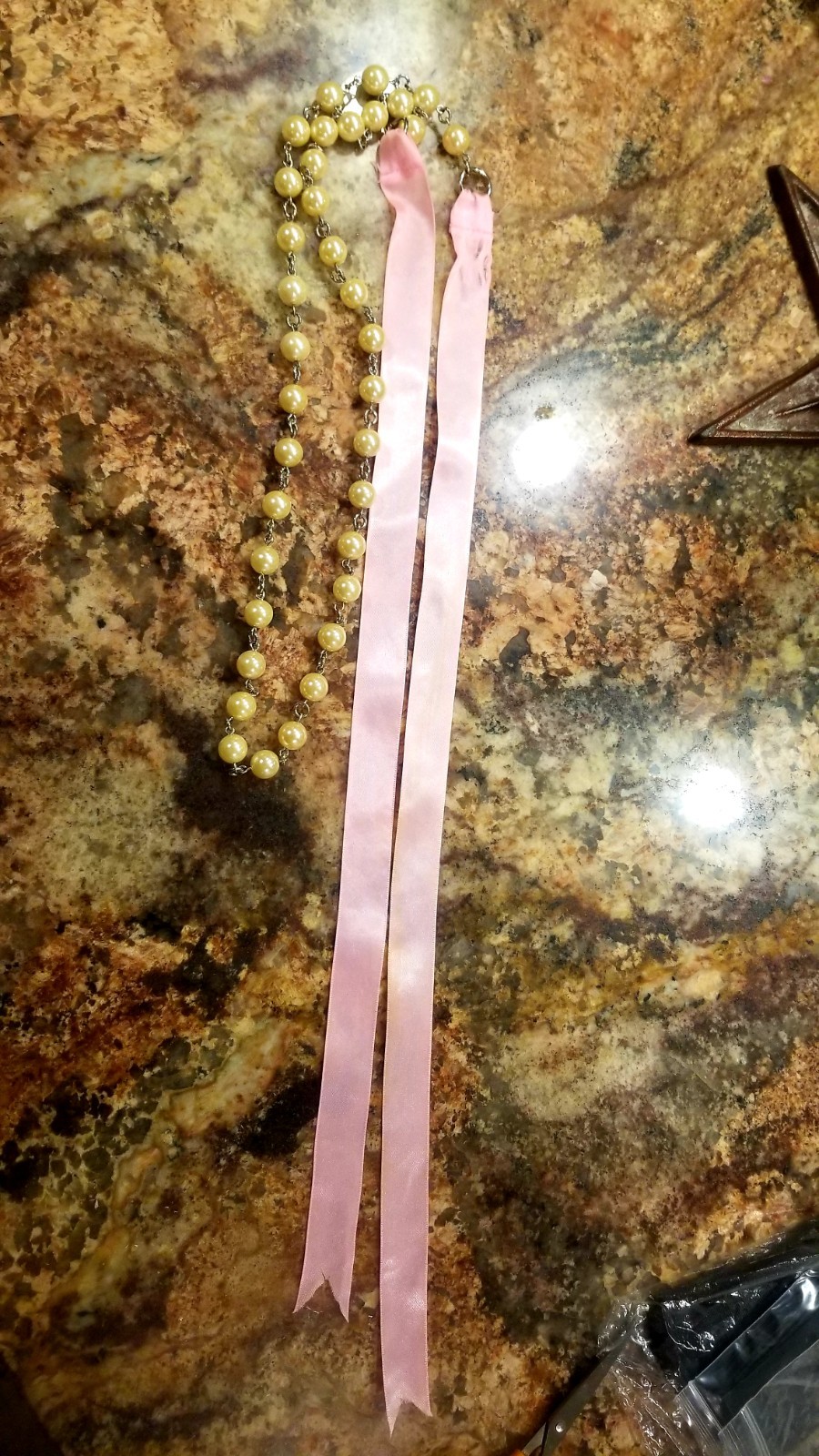 Strand of old fashioned 1960s Pearl’s with pink silk ribbon necklace/belt