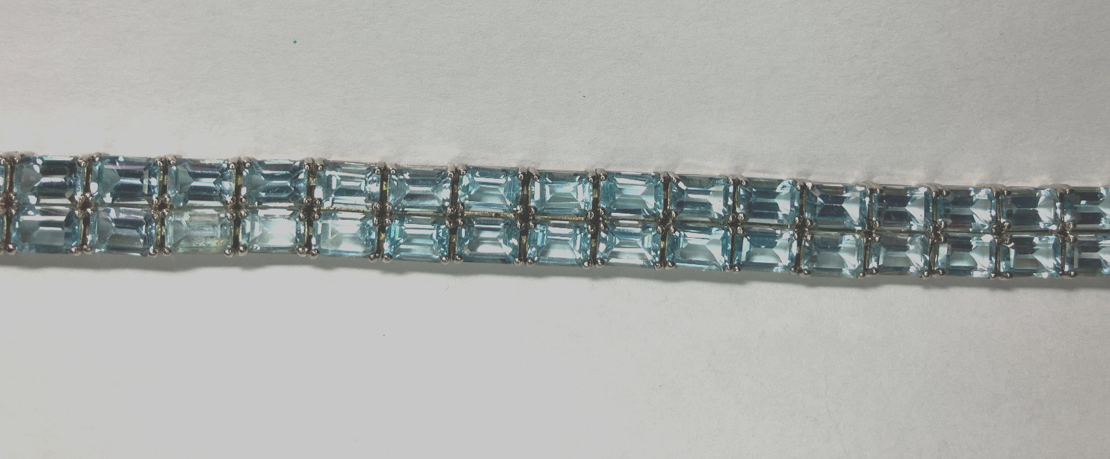 8” TENNIS BRACELET -ADI 925 STERLING SILVER – 40 EMERALD CUT TOPAZ STONES -NICE!