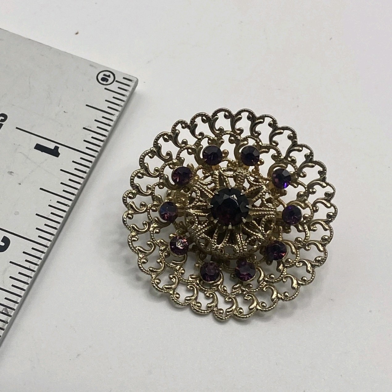 Gold Tone Round Filigree Brooch Pin w/ Purple Crystal Rhinestones, 2 in